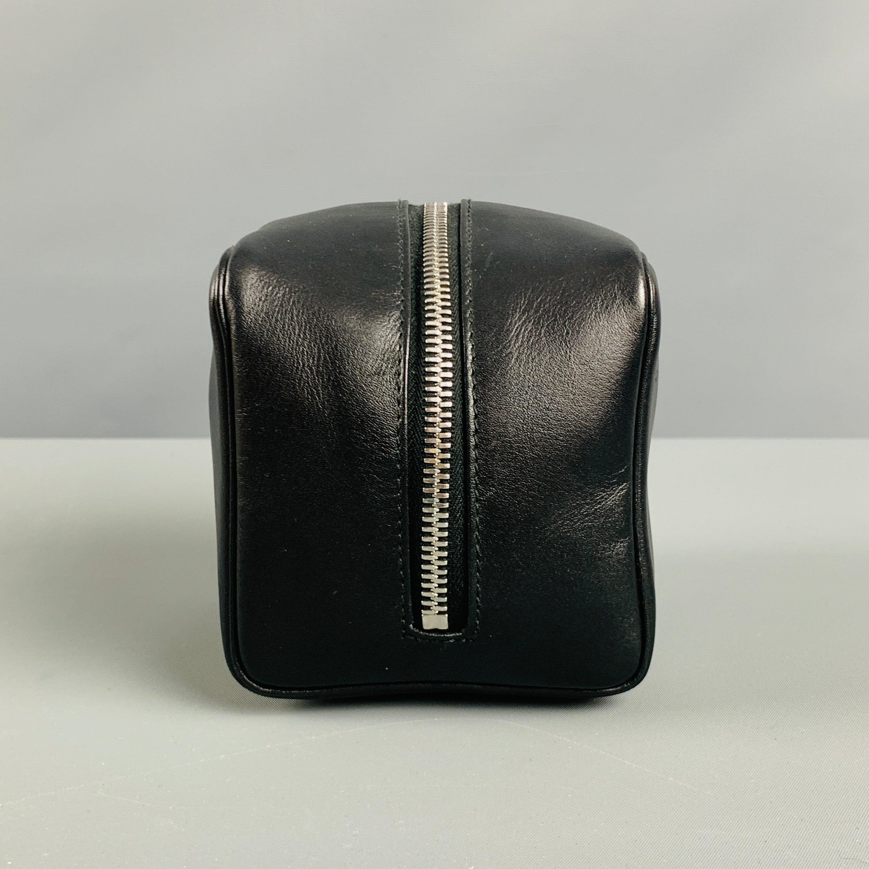 BALLY toiletry bag comes in black leather material featuring a zipper closure. Excellent Pre-Owned Condition. 

Marked:   KELAS GB A C 

Measurements: 
  Length: 4 inches Width: 4 inches Height: 4 inches 
  
  
 
Reference No.: 129200
Category:
