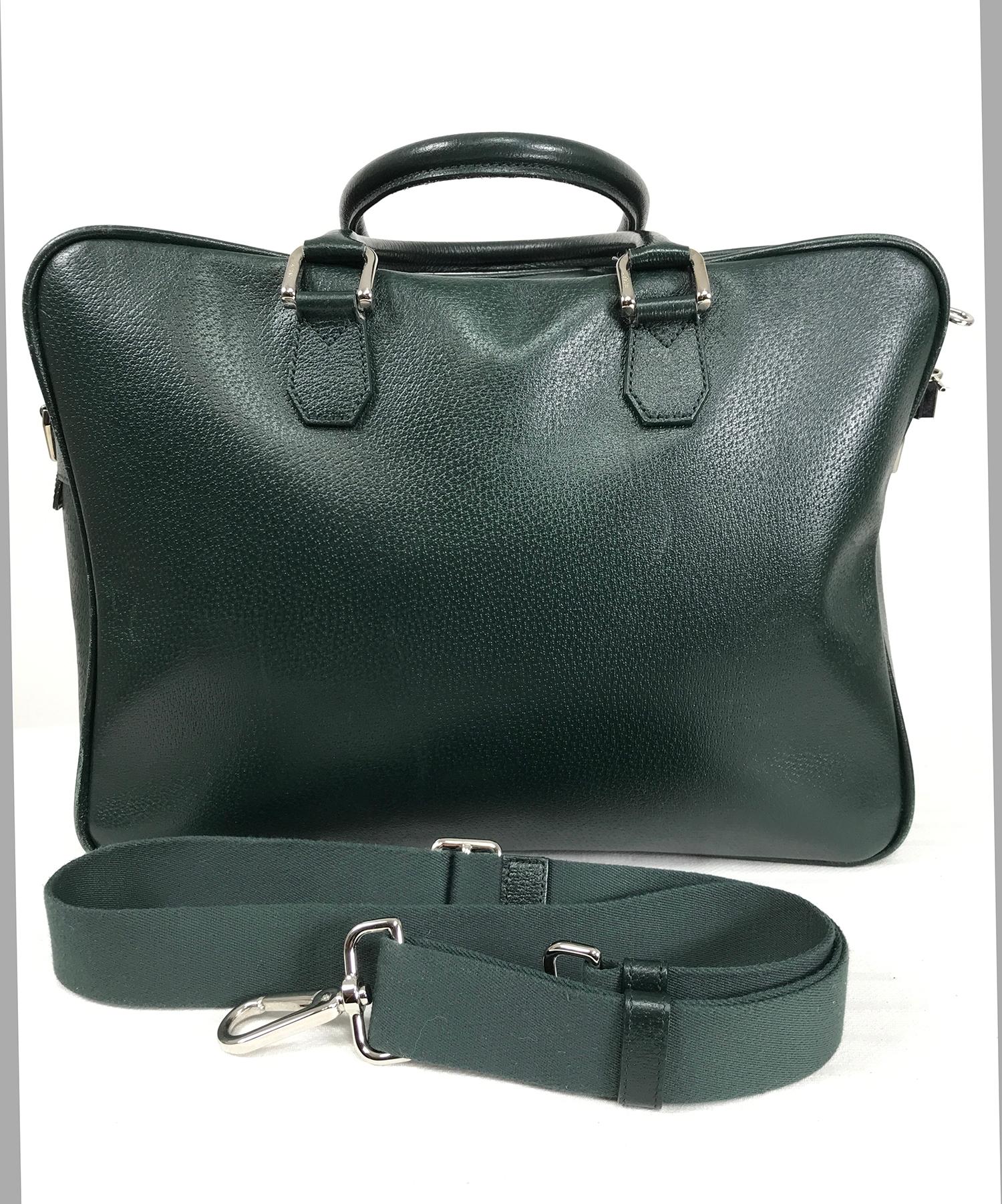 Bally forest green pigskin leather carry on, business bag with removable shoulder strap. Beautiful bag is soft leather, double handles, chrome hardware, logo lock and keys. Zipper outside front compartment. Quilted green lining protects laptop.