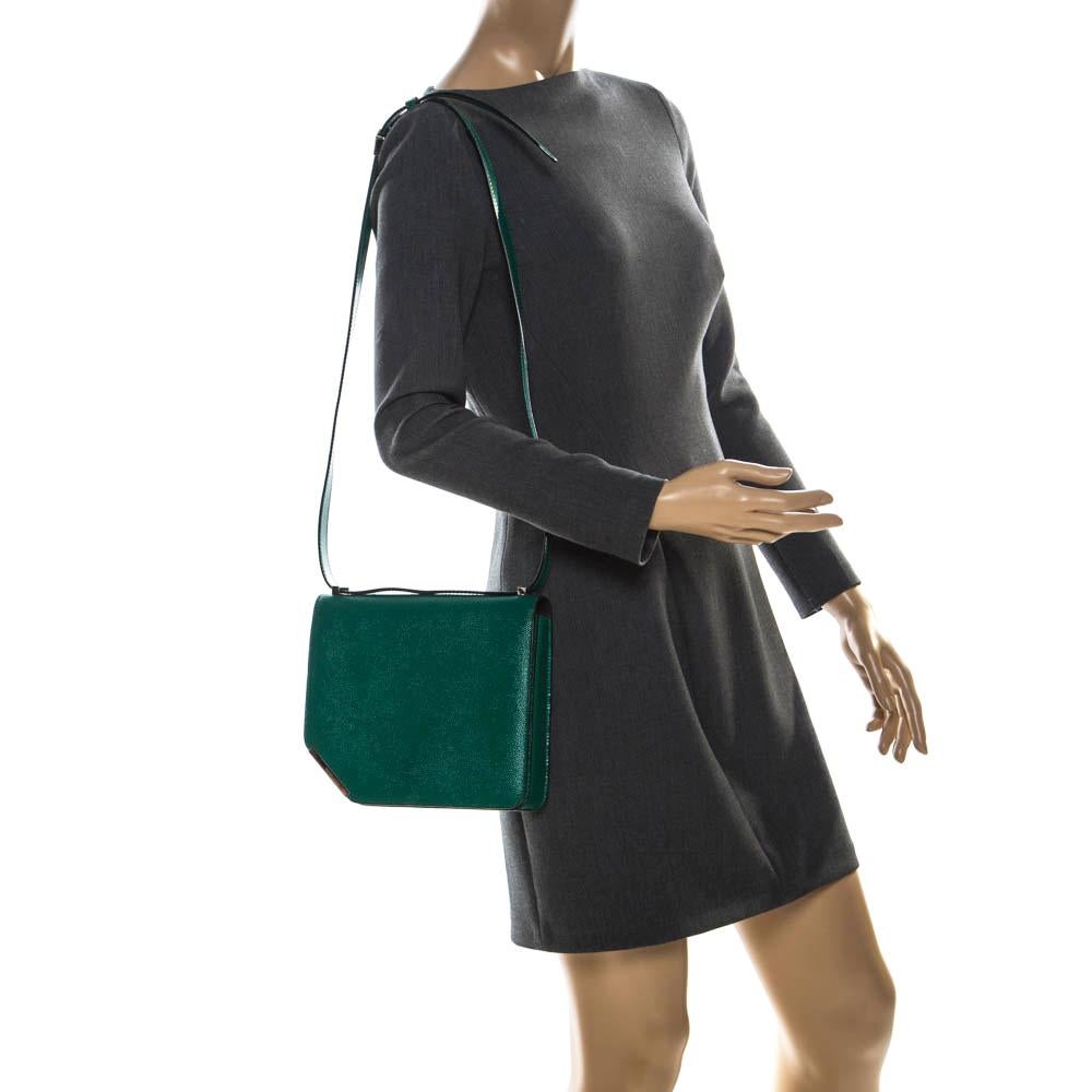 You are going to love owning this shoulder bag from Bally as it is well-made and brimming with luxury. The green creation has been crafted from leather in a unique shape featuring a tapered corner and designed with a front flap that opens to a