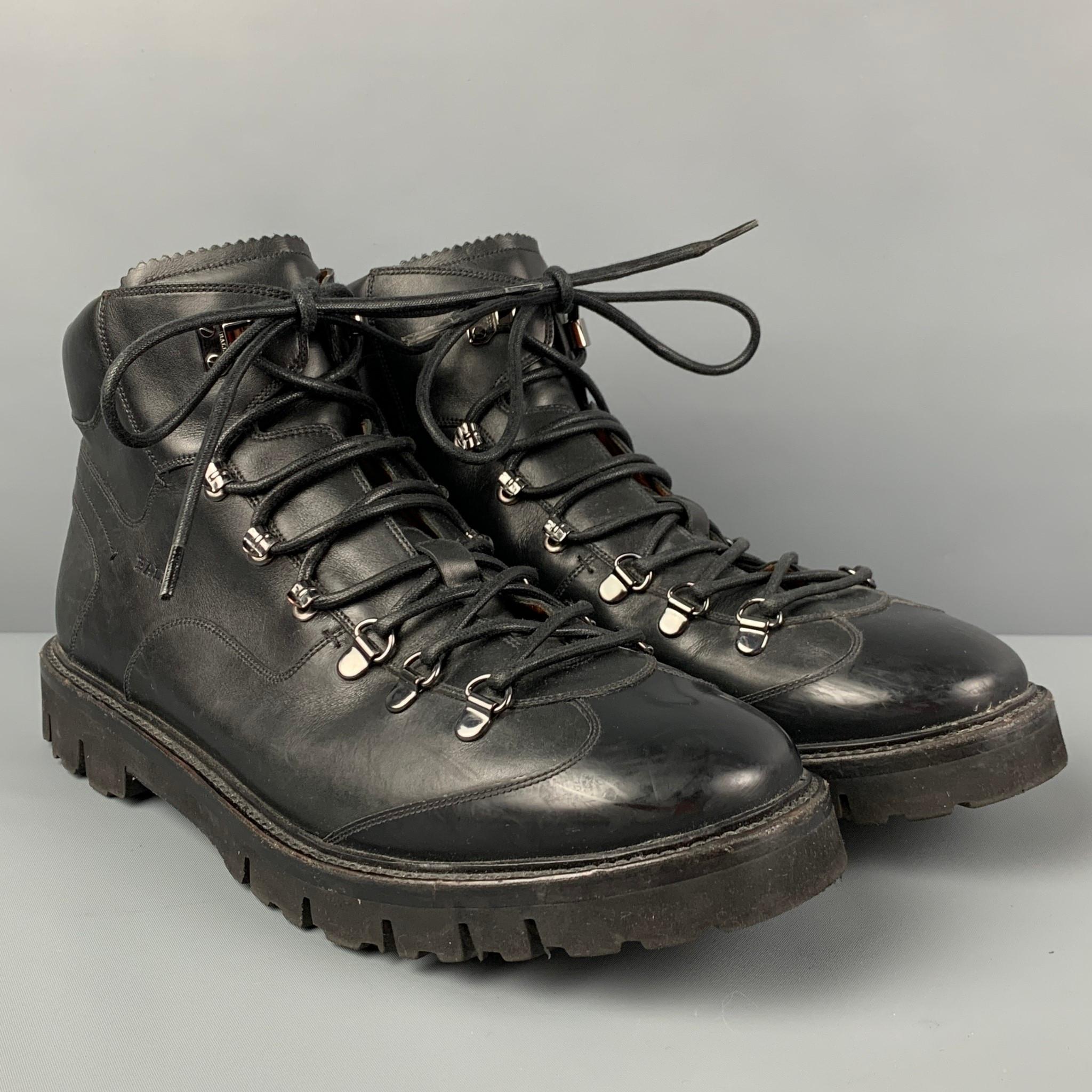 BALLY 'Charls' boots comes in a black leather featuring a hiking style, top stitching, and a lace up closure. Made in Switzerland.

Very Good Pre-Owned Condition.
Marked:EU 9 E / US 10 D

Measurements:

Length: 12.5 in.
Width: 4.25 in.
Height: 4.5