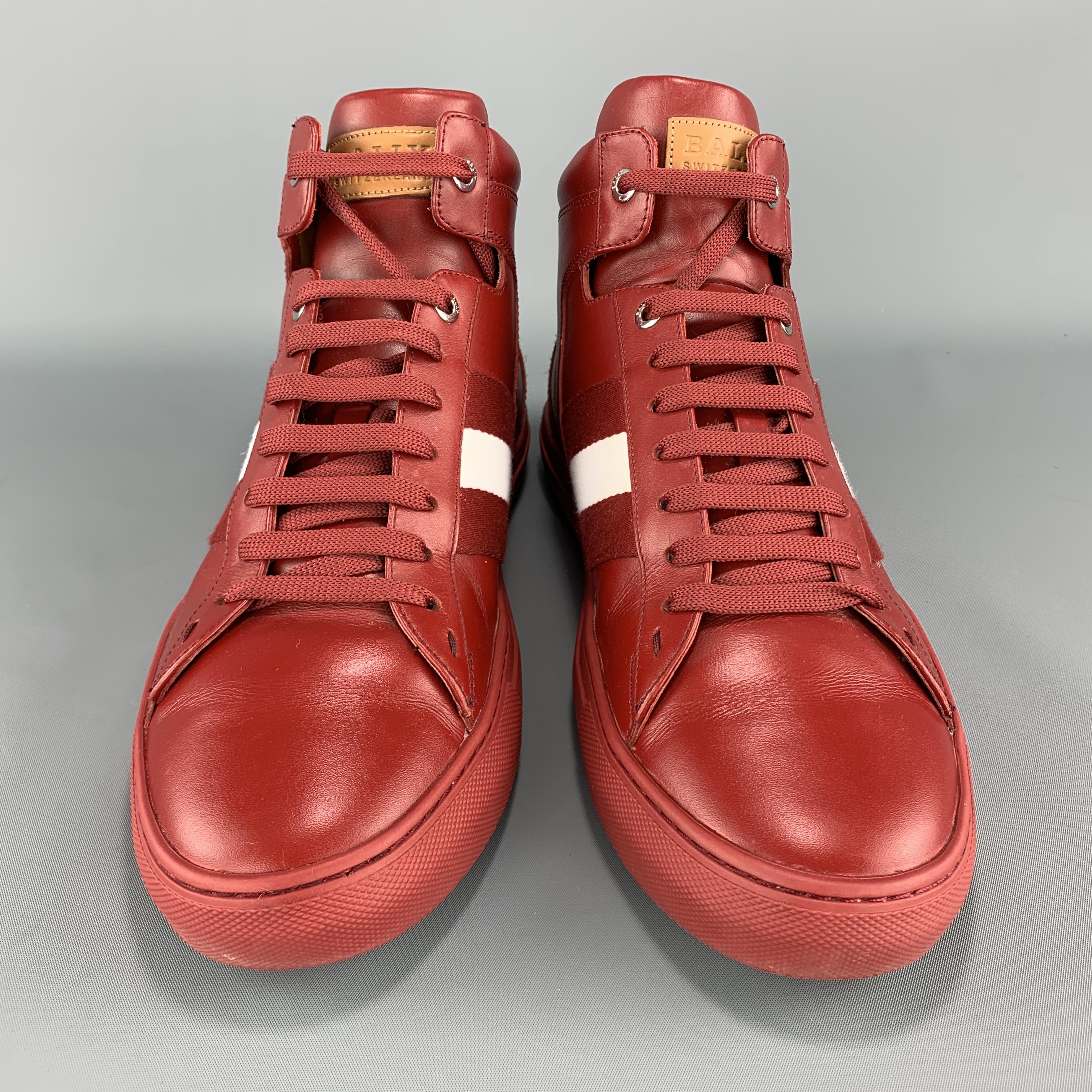 BALLY Hedern high top sneakers come in red smooth leather with a lace up front, webbing white stripe, tonal rubber sole, and silver tone grommets. 

Excellent Pre-Owned Condition.
Marked: US 10

Outsole: 11.75 x 4 in.