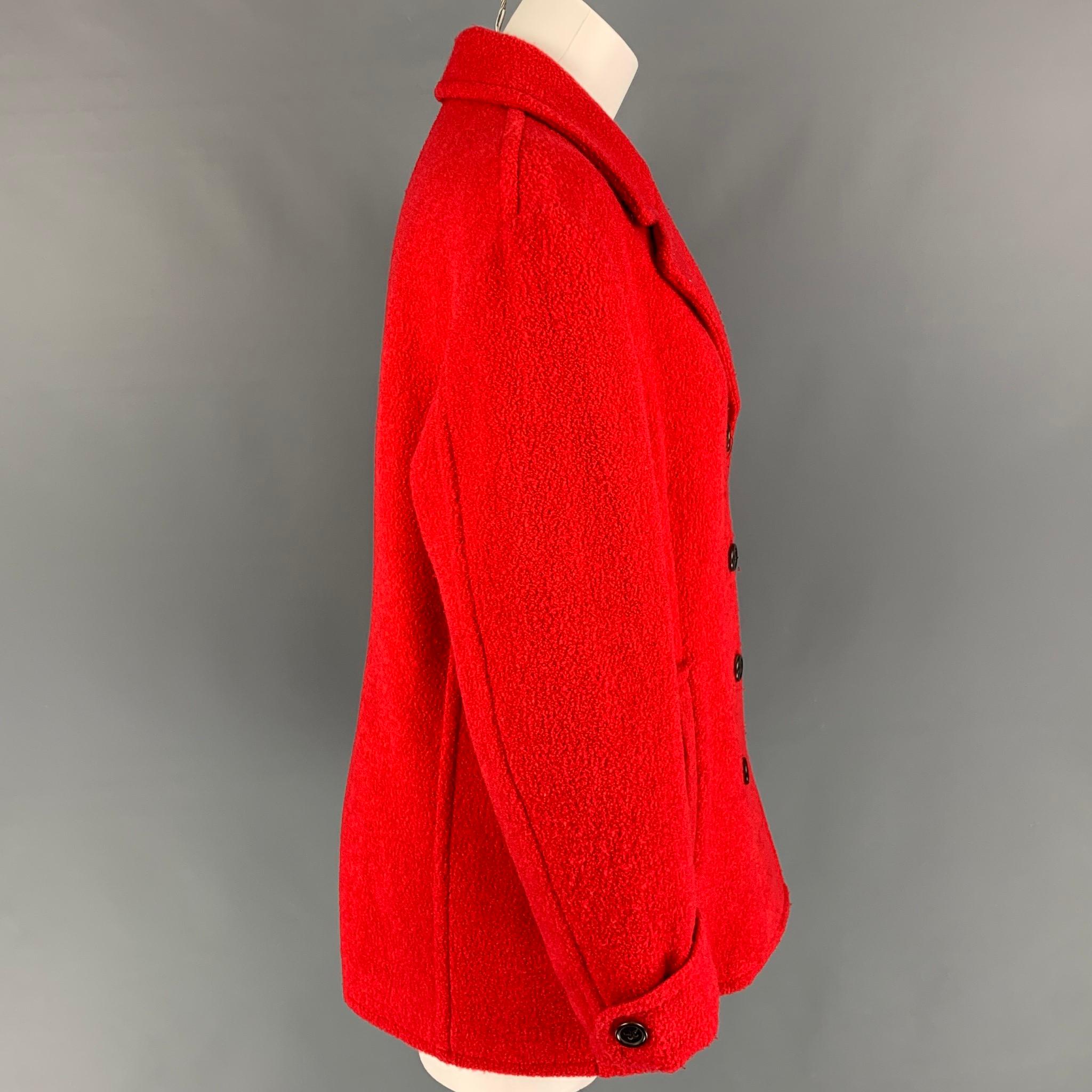 BALLY peacoat comes in a red textured wool blend with a full liner featuring a notch lapel, slit pockets, and a double breasted closure. Made in Italy. 

Very Good Pre-Owned Condition.
Marked: 46

Measurements:

Shoulder: 16.5 in.
Bust: 40