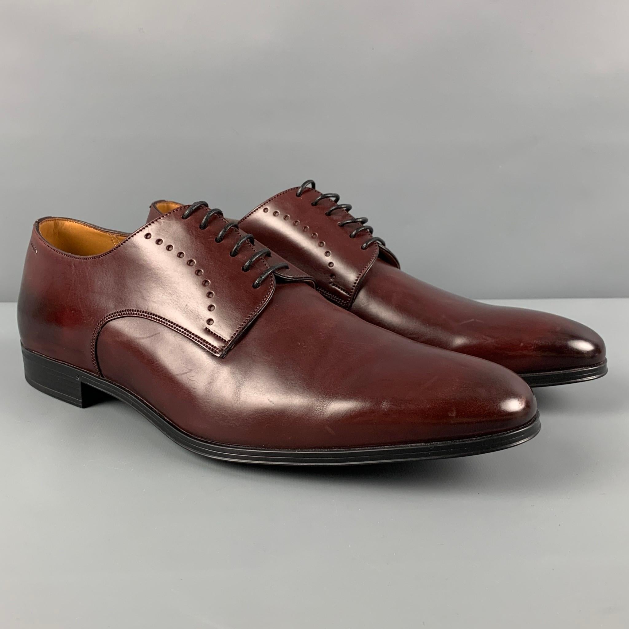 BALLY shoes comes in a burgundy leather featuring a classic style and a lace up closure. Made in Switzerland. 

Very Good Pre-Owned Condition.
Marked: 11.5

Outsole: 12.75 in. x 4 in. 