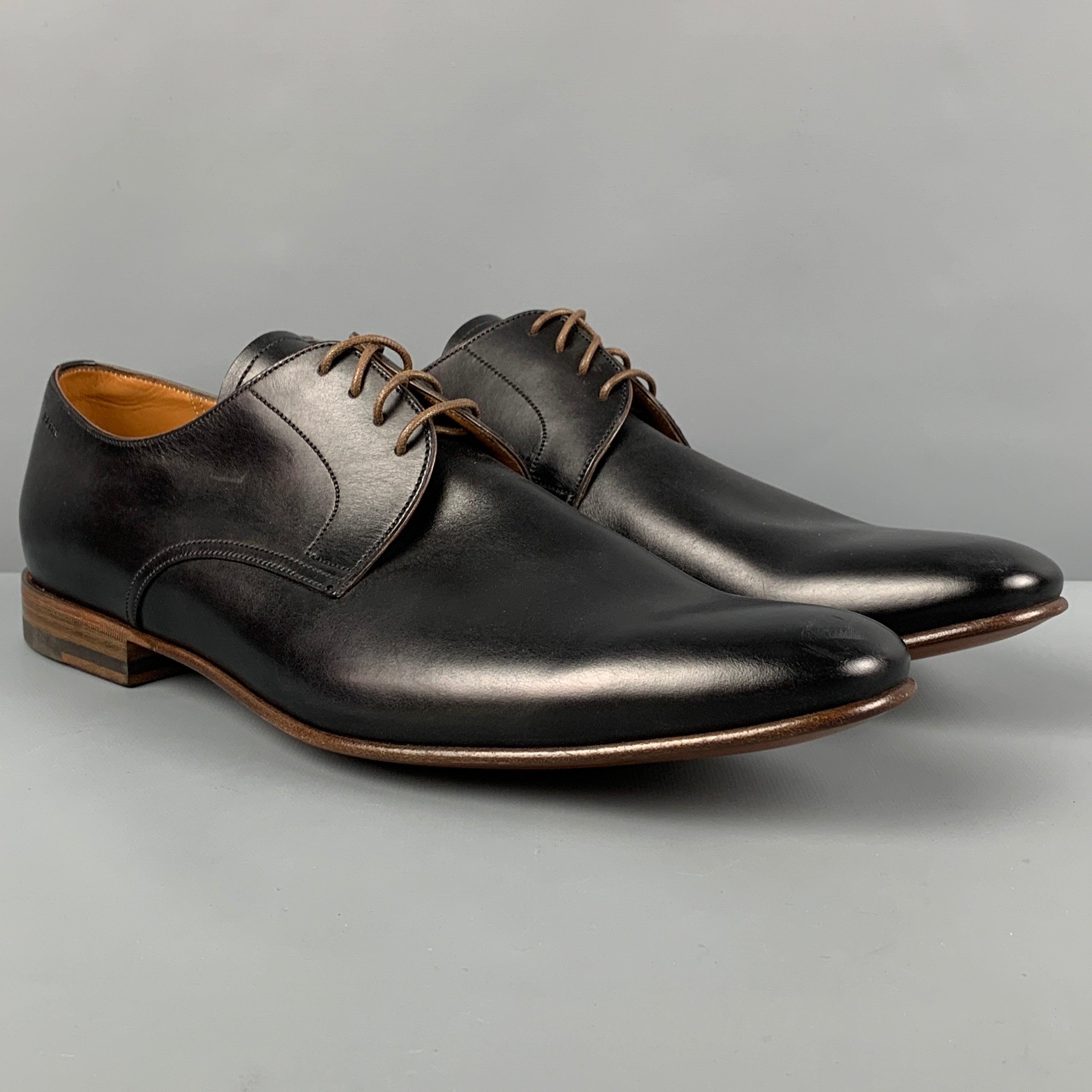 BALLY 'Besty' shoes comes in a black leather featuring a classic style and a lace up closure. Made in Switzerland.
Very Good
Pre-Owned Condition. 

Marked:   12 D Outsole: 13 inches  x 4 inches 
  
  
 
Reference: 119035
Category: Lace Up Shoes
More