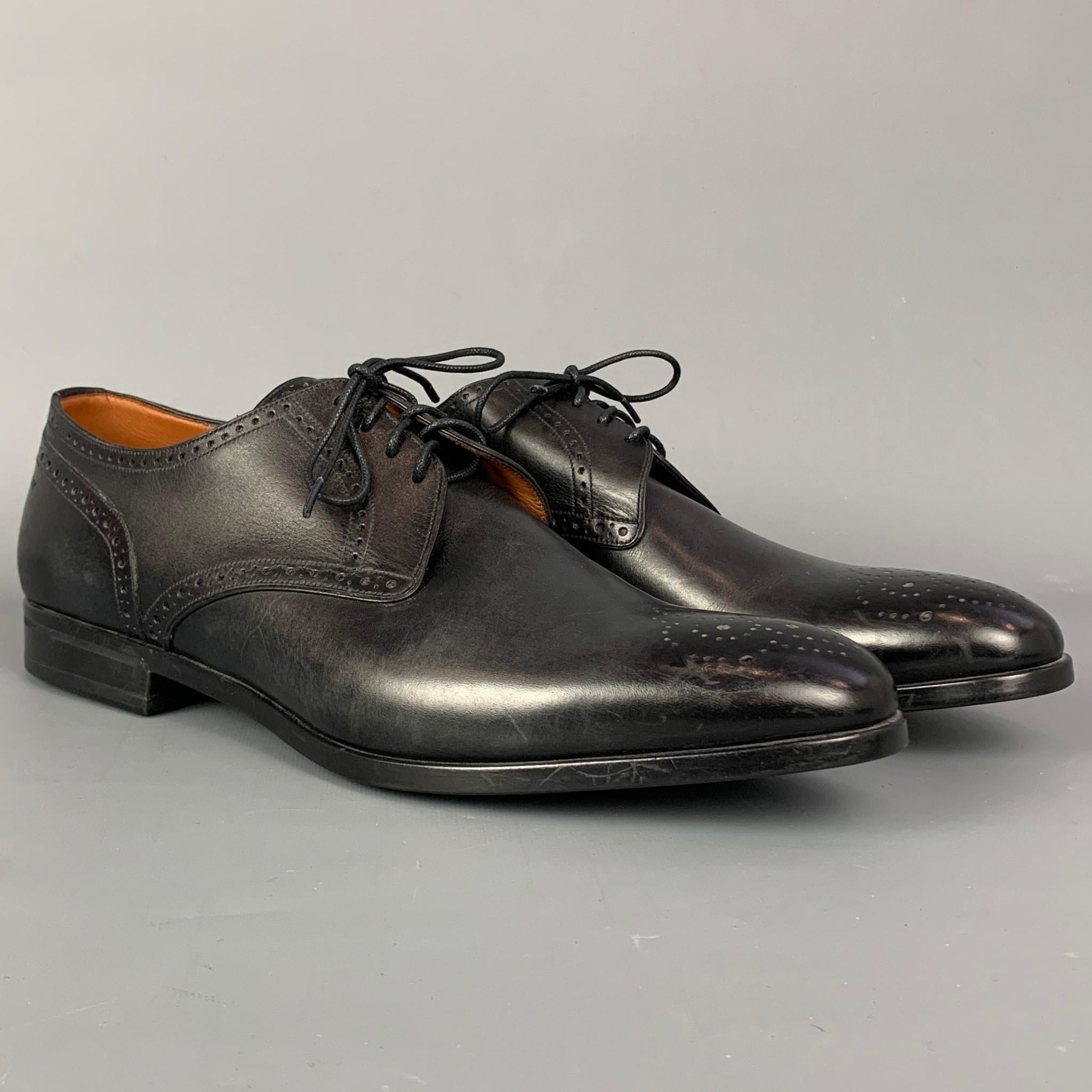 BALLY lace up shoes comes in a black perforated leather featuring a cap toe, rubber sole, and a lace up closure. Made in Switzerland.

Very Good Pre-Owned Condition.
Marked: EU 11 D / US 12 D

Outsole:

12.5 in. x 4 in.

SKU: 110021
Category: Lace