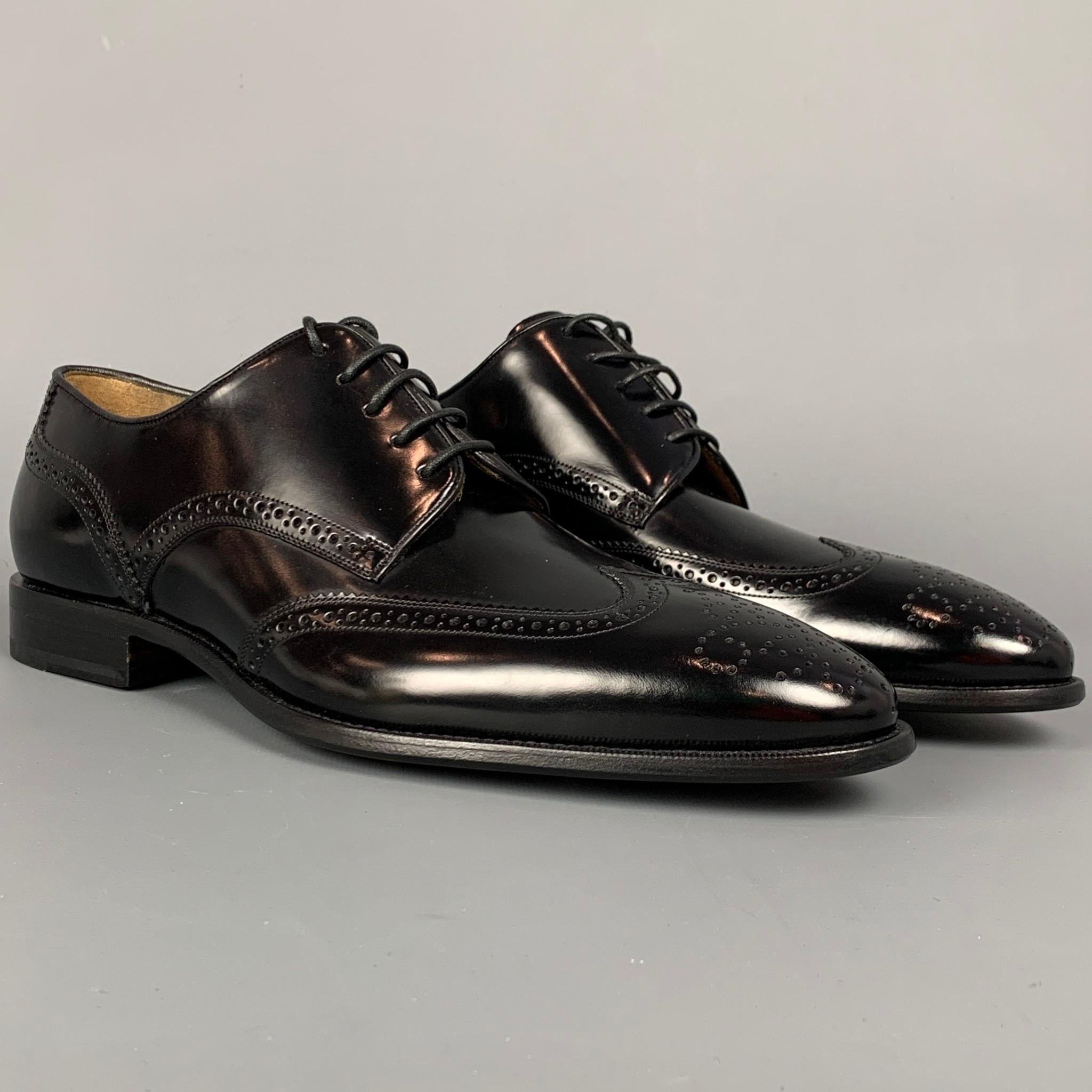 BALLY dress shoes comes in a black perforated leather featuring a wingtip style, wooden sole, and a lace up closure.

New With Box. 
Marked: EU 6 / US 7
Original Retail Price: $750.00

Outsole: 4 in. x 11.5 in. 