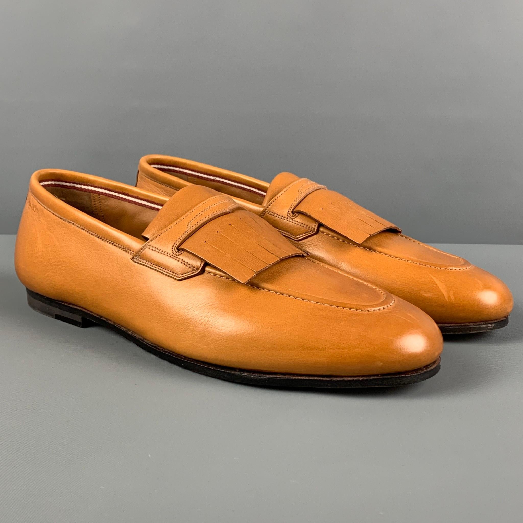 BALLY loafers comes in a honey leather featuring a front fringe design and a slip on style. Includes box. 

Excellent Pre-Owned Condition.
Marked: EU 6.5 / US 7.5

Outsole: 11 in. x 3.75 in. 