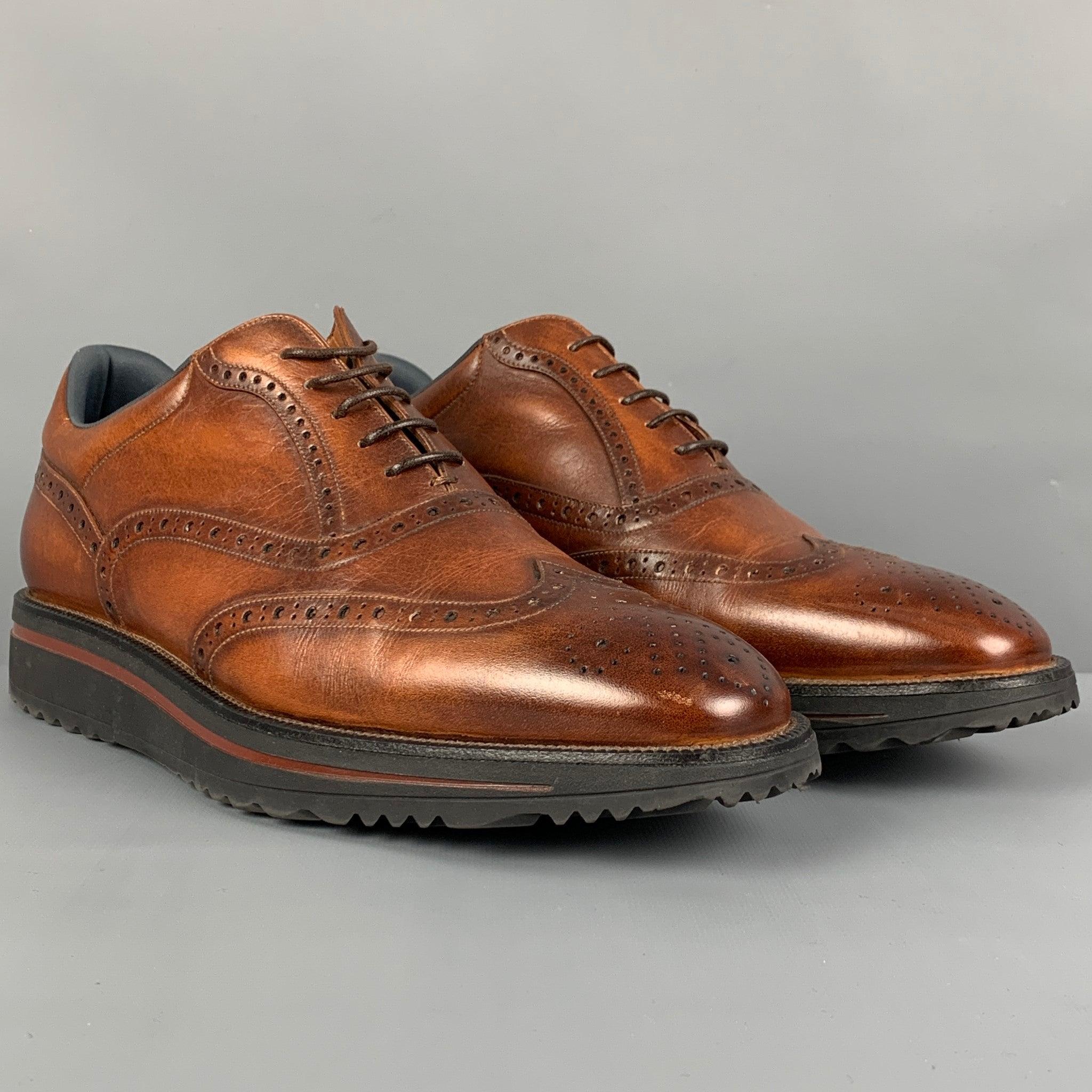 BALLY shoes comes in a brown antique leather featuring a wingtip style, rubber sole, and a lace up closure. Made in Italy.
Excellent
Pre-Owned Condition. 

Marked:   EU 7.5 E / US 8.5 D Outsole: 12 inches  x 4.25 inches 
  
  
 
Reference: