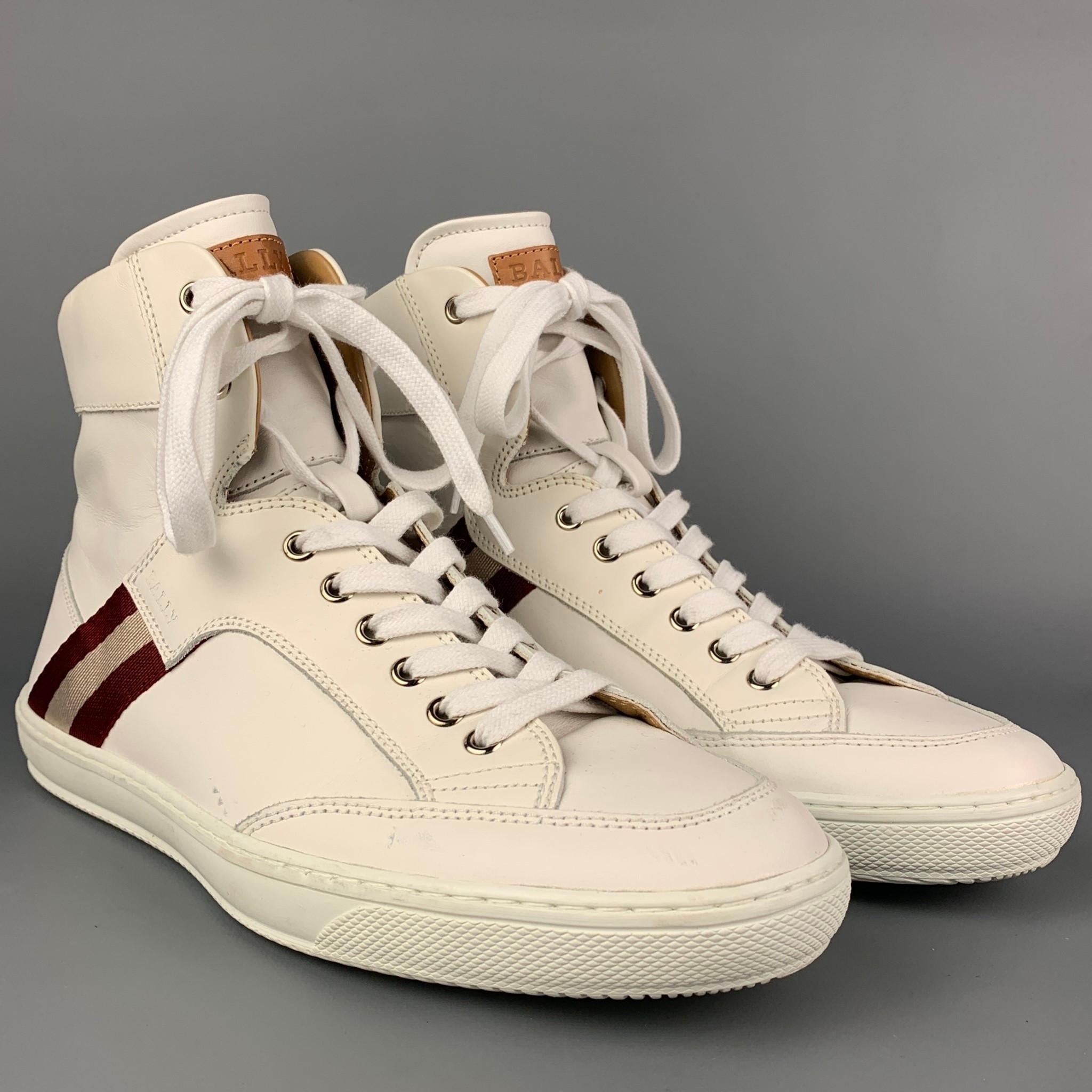 BALLY sneakers comes in a white & burgundy leather featuring a high top style, ribbon trim, and a lace up closure. Made in Italy. 

Very Good Pre-Owned Condition.
Marked: 8 EU  9 US
Original Retail Price: $550.00

Outsole: 11.5 in. x 4 in. 