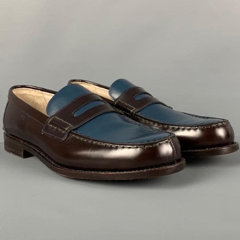 BALLY 'Perry' loafers comes in a brown & blue two toned leather featuring a penny strap and a slip on style. Made in Switzerland.Very Good
Pre-Owned Condition. 

Marked:   EU 8.5 E / US 9.5 DOutsole: 11.75 inches  x 4 inches 
  
  
 
Reference: