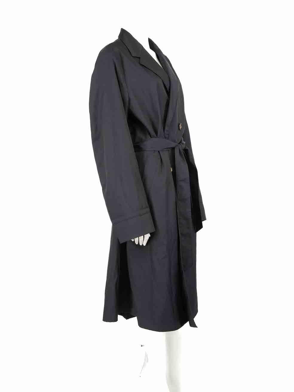 CONDITION is Very good. Minimal wear to coat is evident. Minimal wear to brand label where a sharpie mark is seen on this used Bally designer resale item.
 
Details
SS21
Black
Synthetic
Trench coat
Long sleeves
Belted
Button up fastening
Double
