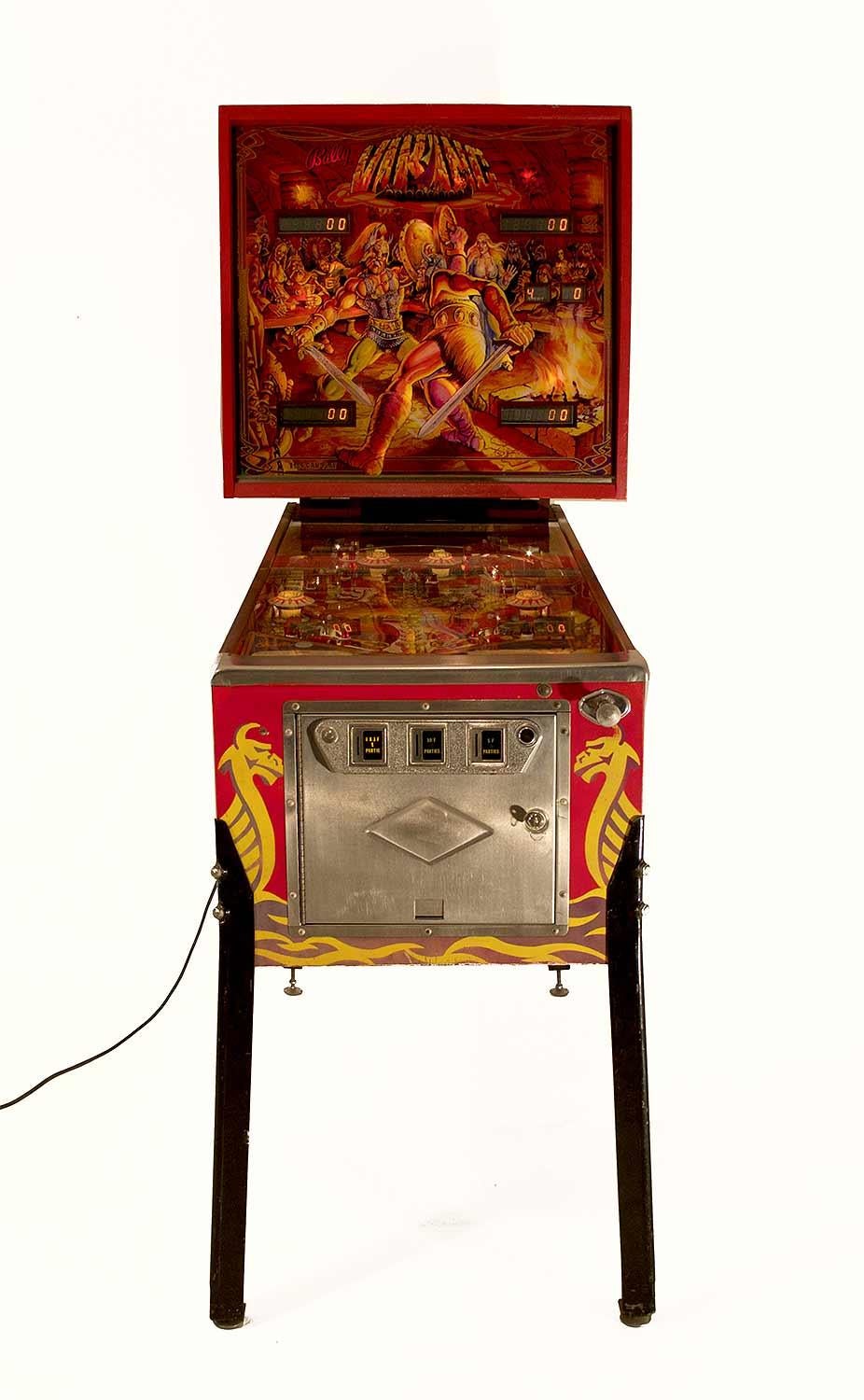 Viking Pinball by Bally in red painted wood with yellow patterns representing on each side a Viking with a helmet holding his sword and his shield. 
On the main screen, two characters are fighting and the character on the left is a self-portrait of