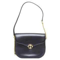 BALLY Bolso caja vintage de piel lisa negra y cadena dorada con cierre giratorio