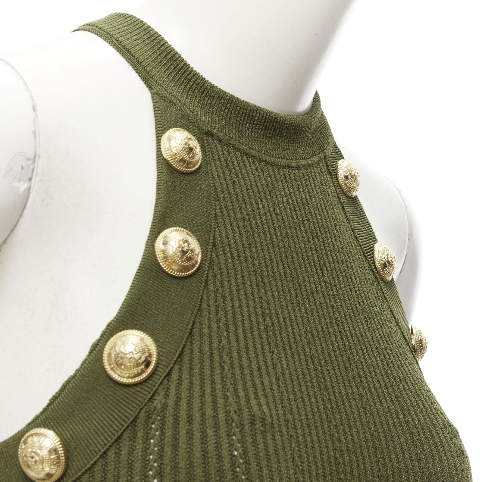 BALMAIN 2021 green viscose knit gold military button halter top FR34 XS
Reference: AAWC/A00215
Brand: Balmain
Designer: Olivier Rousteing
Collection: 2021
Material: Viscose, Polyester
Color: Green, Gold
Pattern: Solid
Extra Details: Decorative