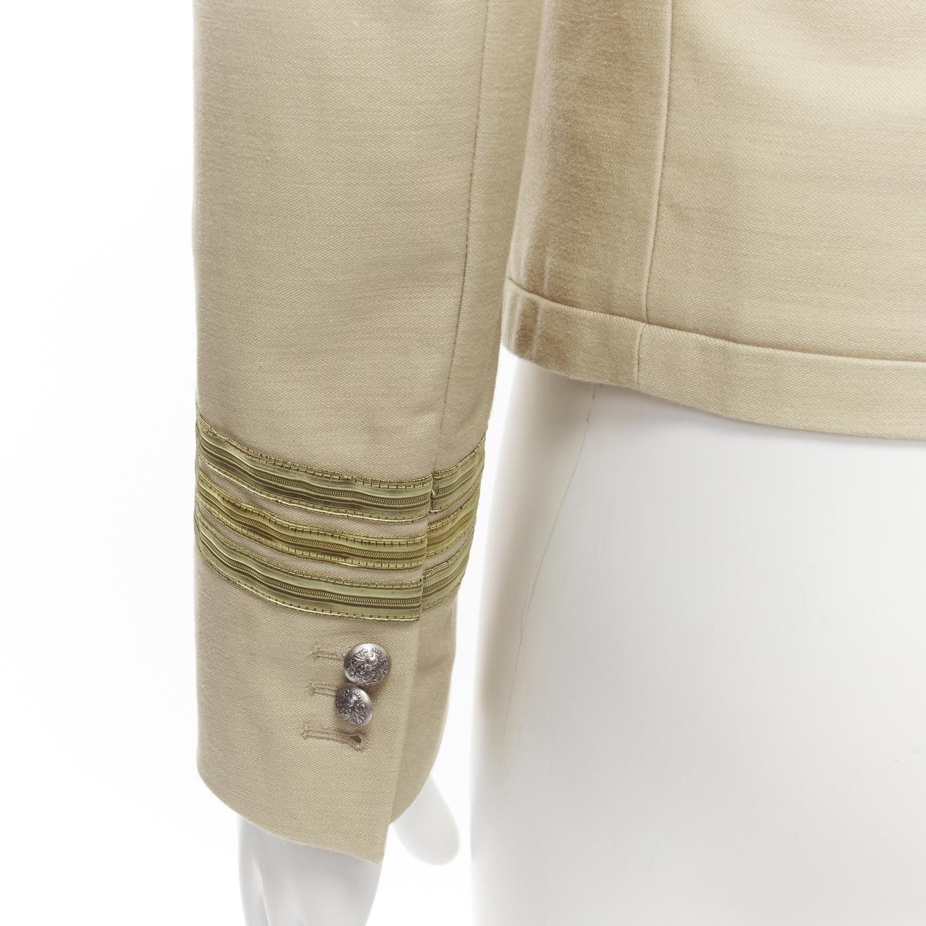 BALMAIN beige cotton military officer gold trim zippers cropped fitted jacket EU46 S
Reference: EDTG/A00083
Brand: Balmain
Designer: Olivier Rousteing
Material: Cotton
Color: Nude
Pattern: Solid
Lining: Beige Fabric
Extra Details: Gold trimming at