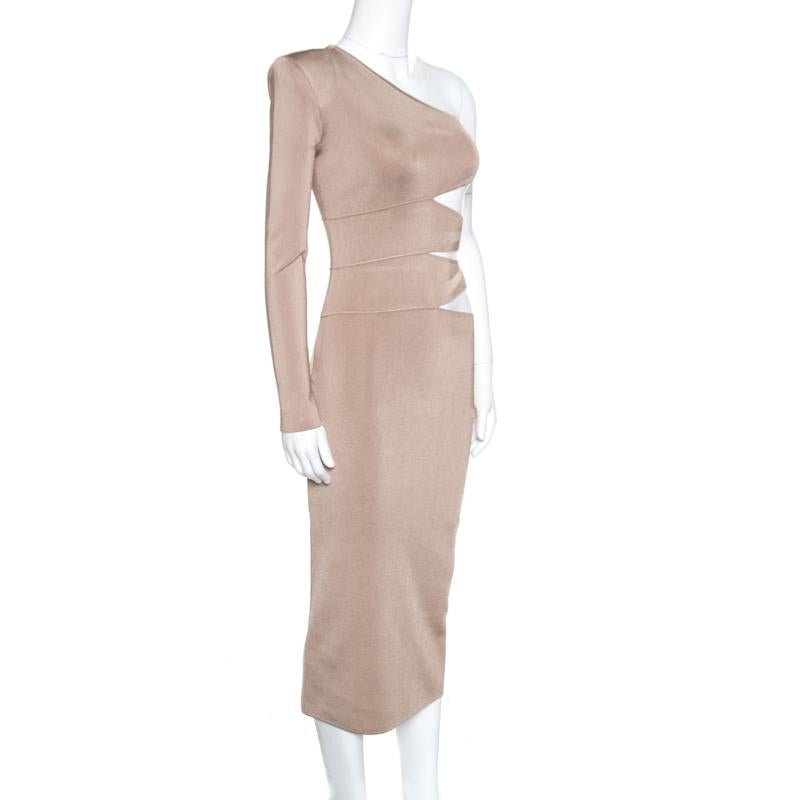 Balmain is all about powerful dressing and this beige knit dress is just another example. It is made of a blend of fabrics and features a flattering silhouette. It flaunts a one shoulder design and artistic cutouts that define the waist really well.