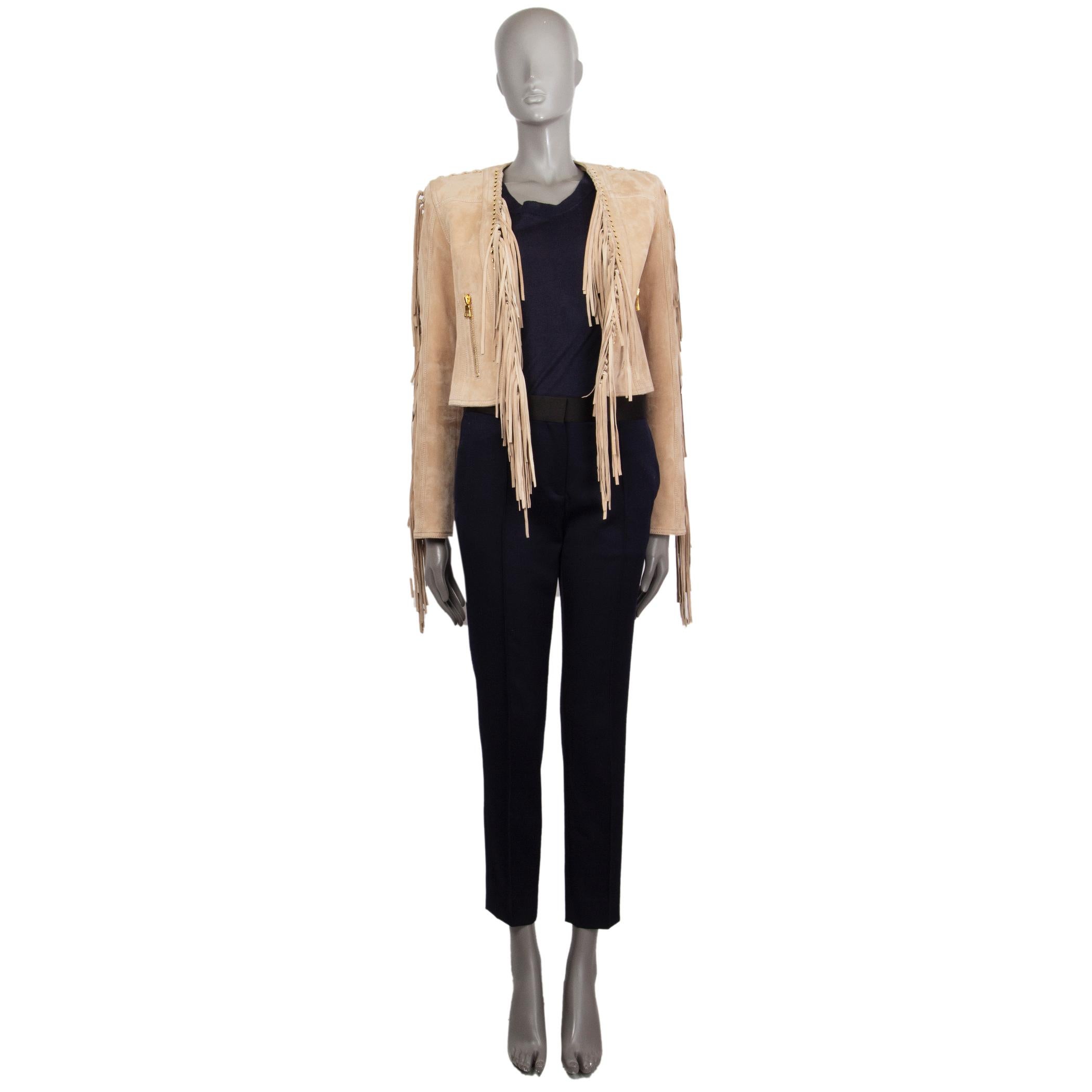 Balmain cropped fringed jacket in beige lambskin (100%) with an open front detailed with fringes along the seam down, two front zipped pockets, long sleeve. Features some  on the side Linded viscose (52%) cotton (48%). Has been worn and is in