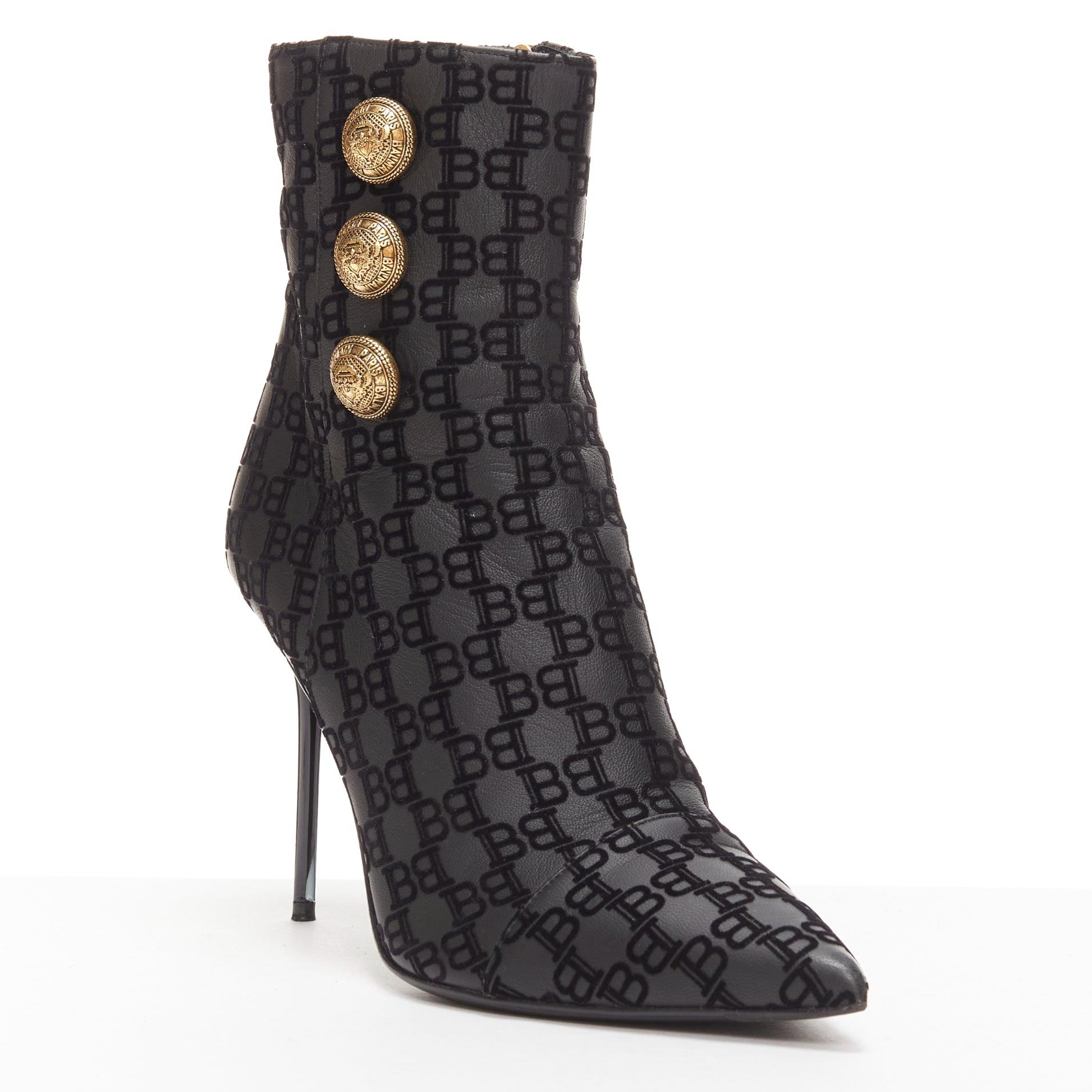 BALMAIN black BB monogram gold buttons high top stiletto boots EU38
Reference: AAWC/A00949
Brand: Balmain
Designer: Olivier Rousteing
Material: Leather
Color: Black, Gold
Pattern: Monogram
Closure: Zip
Lining: Black Leather
Extra Details: Balmain