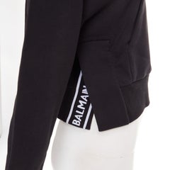 BALMAIN black cotton flocked felt logo print side split cropped fleece hoodie XS