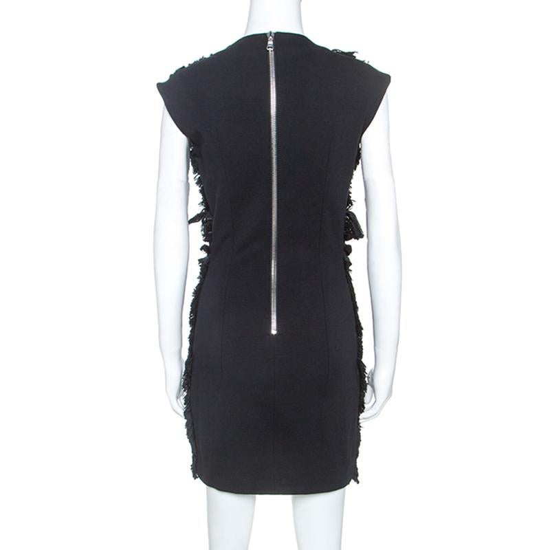 Your unique style deserves a fabulous wardrobe and what better an addition than this mini dress from Balmain. This black dress has been tailored from quality fabrics and designed with trims of fringes and a back zipper.

