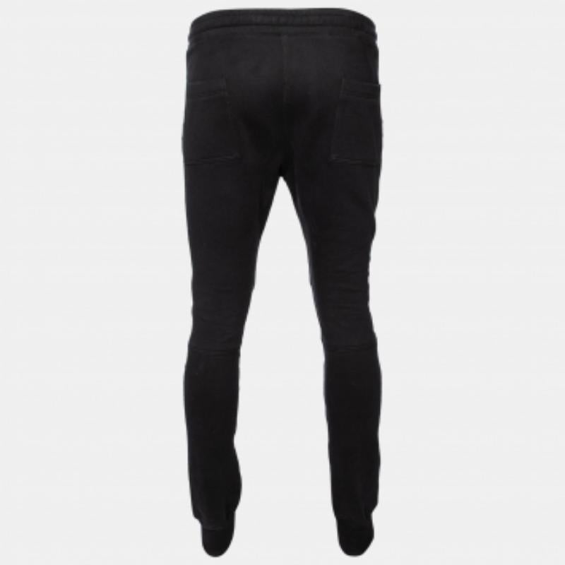 Balmain brings you these suave track pants that you can wear from day to night. Sewn meticulously from black cotton, the pants showcase rib paneling at the knees and have a fitted shape. They strike the right balance of comfort and high fashion.
