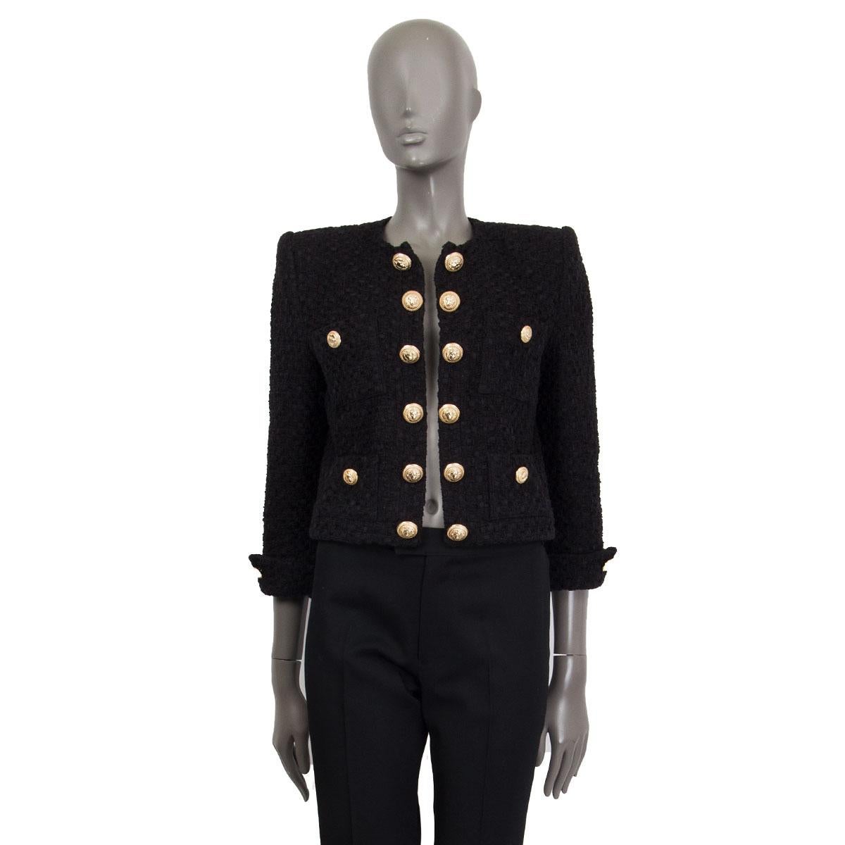 100% authentic Balmain cropped bouclé jacket in black cotton (48%), polyamide (24%), polyester (14%) and viscose (14%) featuring padded shoulders and breast pockets with crest-embossed button detail. The jacket can not be closed, crest-embossed
