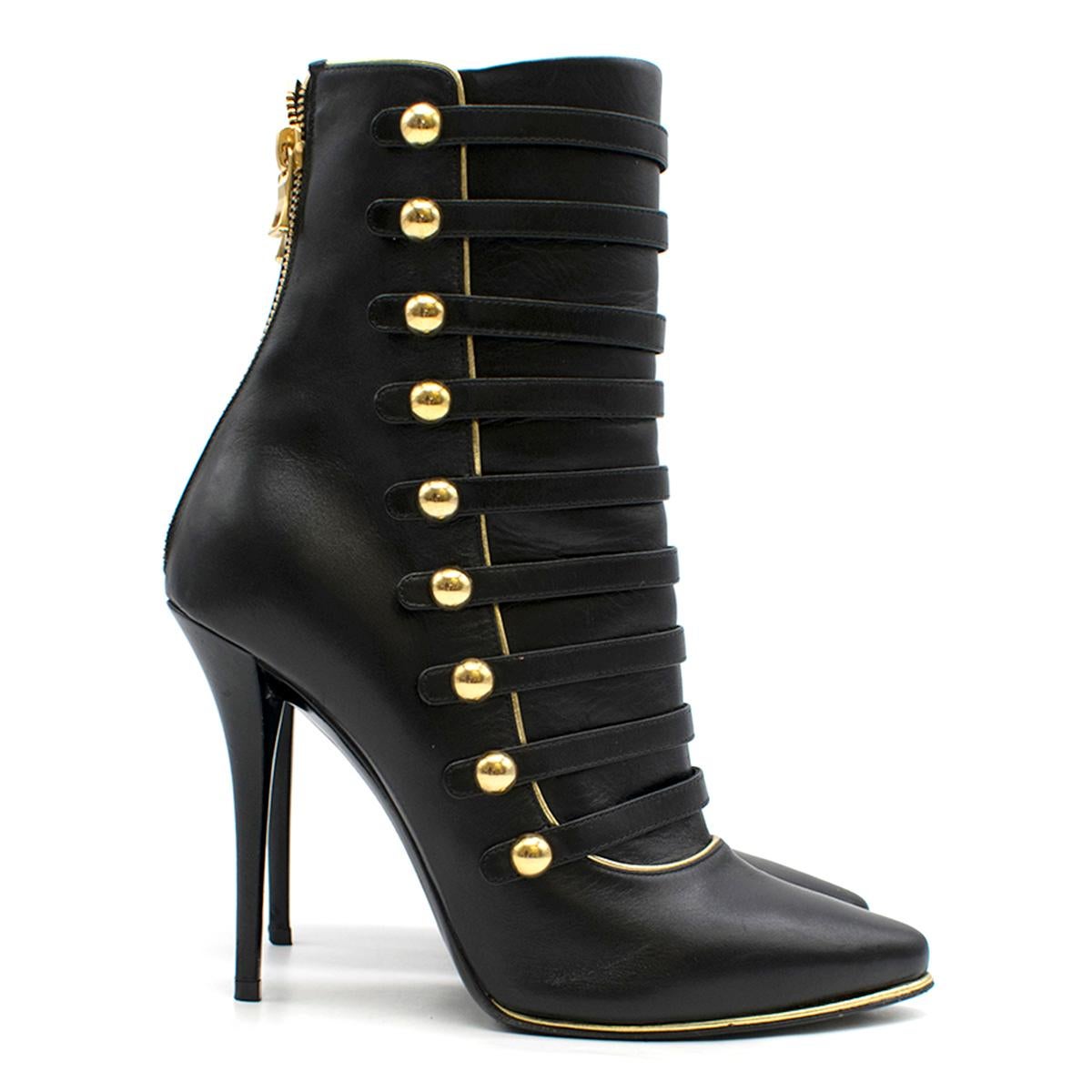 Balmain Black Leather Ankle Boots

- Black leather ankle boots
- 110mm stiletto heels
- Pointed collar
- Centre-back zip fastening
- Front multi-strap feature with gold-tone metal detail
- Black leather lining with logo embroidered

Please note,