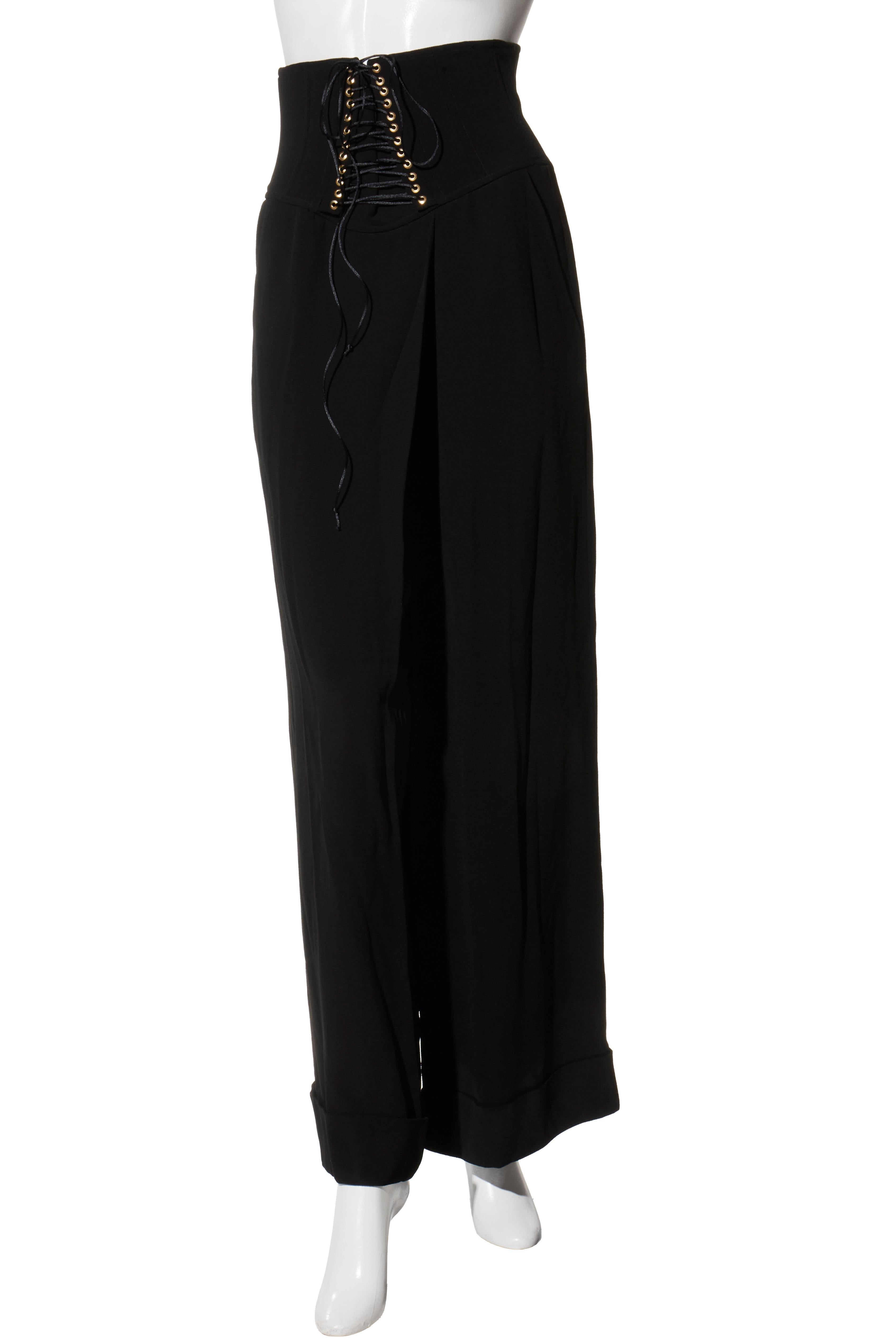 Balmain Black High-Waisted Corset Wide-Leg Pants with Gold Lace-Up Detail

Description:
These Balmain high-waisted corset trousers are a statement piece from Olivier Rousteing’s era of bold, structured tailoring. Crafted in France from a fluid black