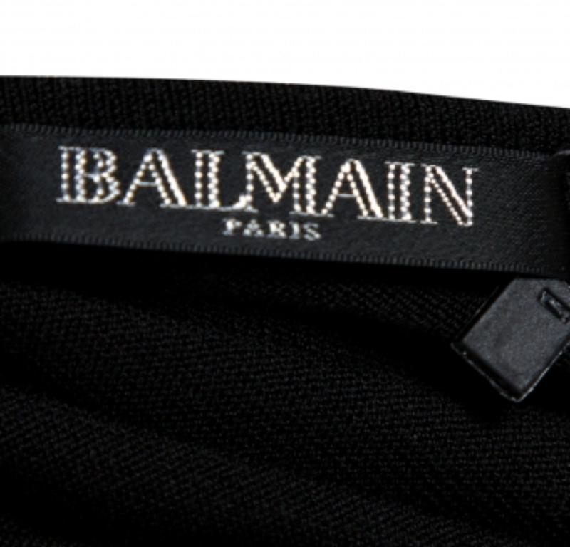 This stylish, simple, and yet edgy creation comes from the house of Balenciaga. It has been crafted from quality jersey materials and carries a classic shade of black. It has been designed with short sleeves, a square-shaped neckline, and a fitted
