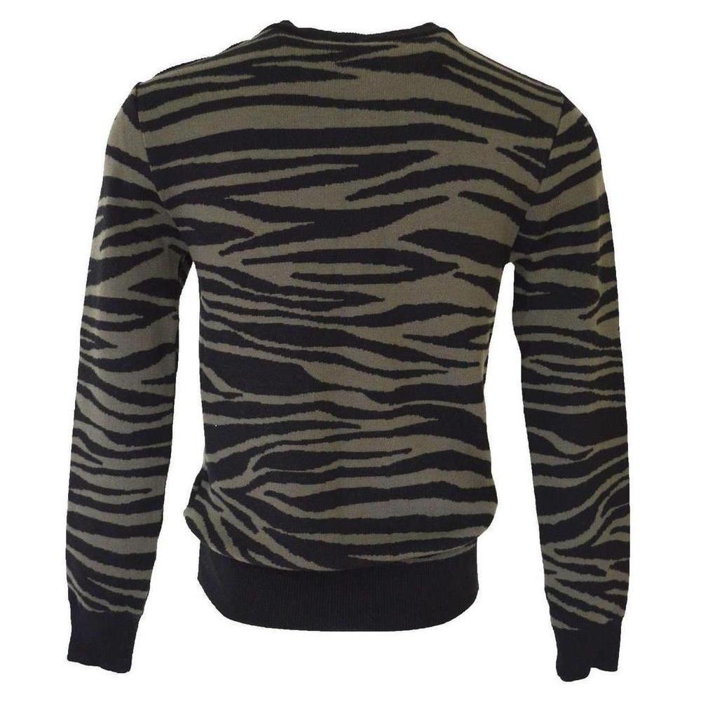 Long sleeve merino wool sweater in black and khaki green zebra print. Ribbed crewneck collarShoulder placket, sleeve cuffs, and hem. Four signature silver-tone buttons at shoulder placket. Tonal stitching. 100% merino wool. Made in France