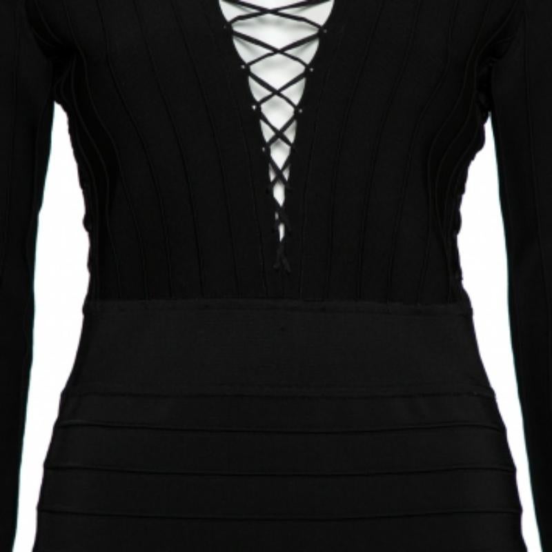 This Balmain black mini dress is a statement-making choice. It's sewn using knit fabric and designed with lace-up details along the V neckline, long sleeves, and back zip closure. The dress can be styled with both pumps, booties, and sandals.