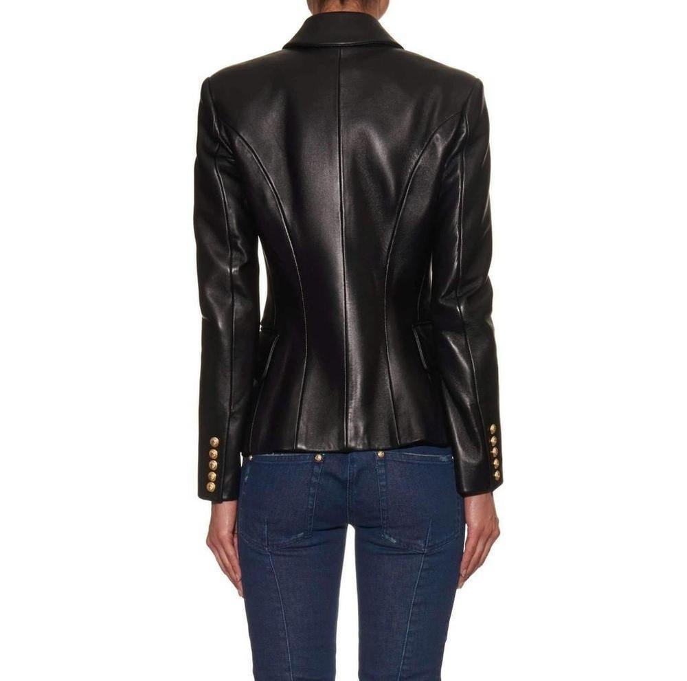 Balmain's double-breasted jacket re-imagines the brand's signature sharp-shouldered silhouette in smooth polished lambskin.
Creating the illusion of a narrower waist, the jacket is cut with a crossover front, and detailed with embossed gold