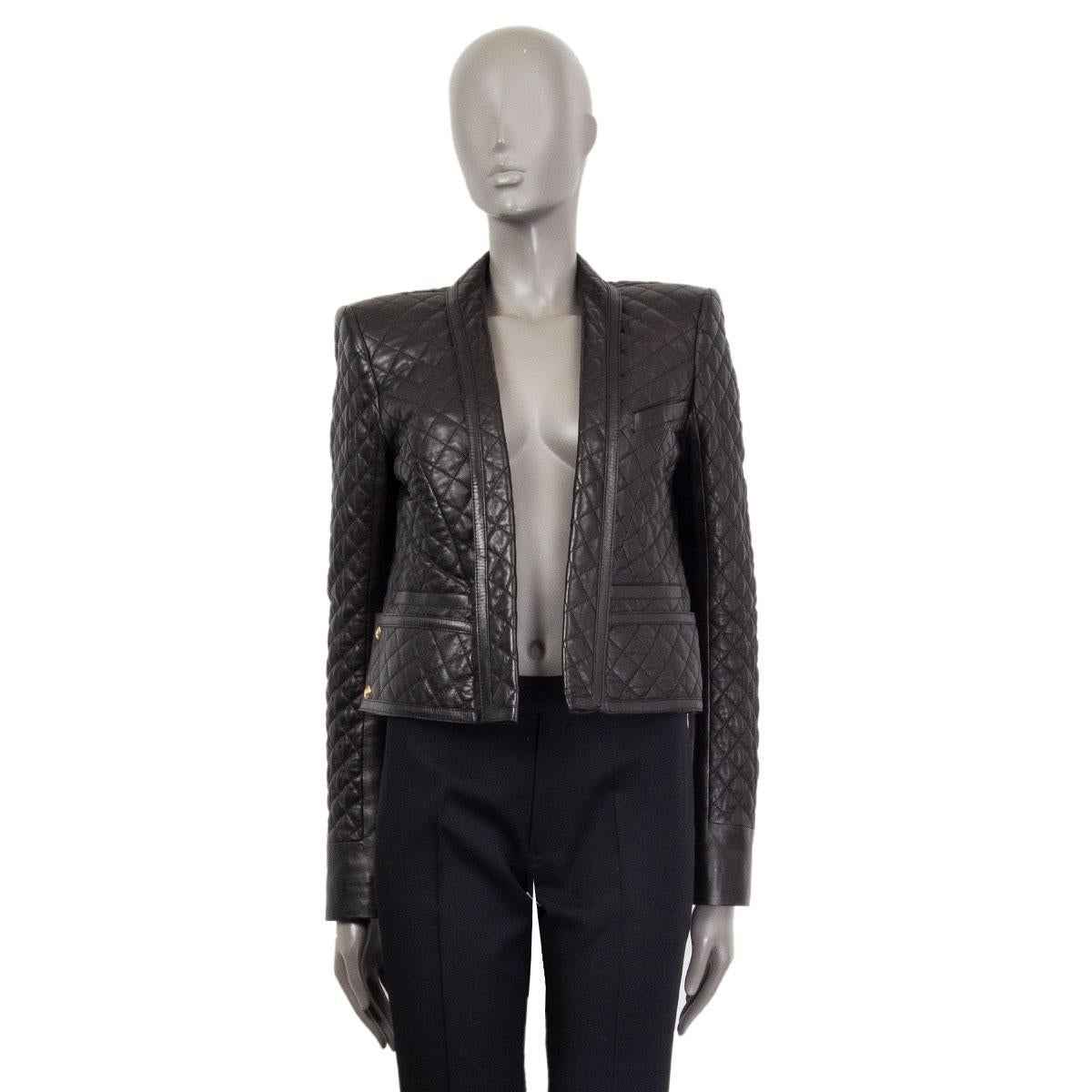 100% authentic Balmain quilted leather blazer in black lambskin (100%). With an open front, shawl lapel, three straight pockets and buttons at the back of the sleeves. Lined in black viscose (52%) cupro (48%). Has been worn and is in excellent