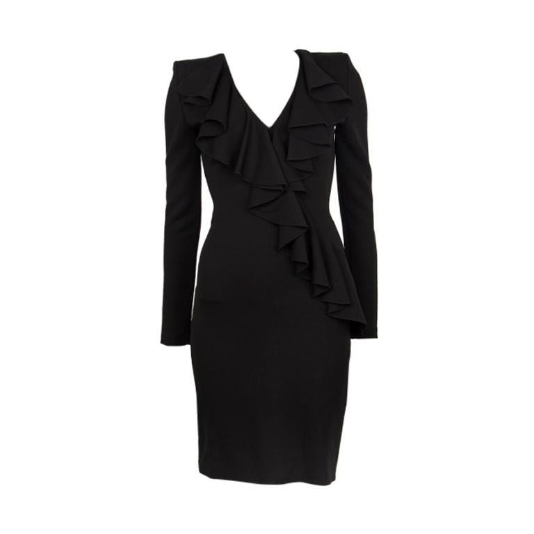 Balmain ruffle dress in black polyester (35%) and viscose (65%) with a v-neck, padded shoulders and long sleeves. Closes with a gold zipper on the back. Unlined. Has been worn and is in excellent condition.

Tag Size 36
Size XS
Shoulder Width 72cm