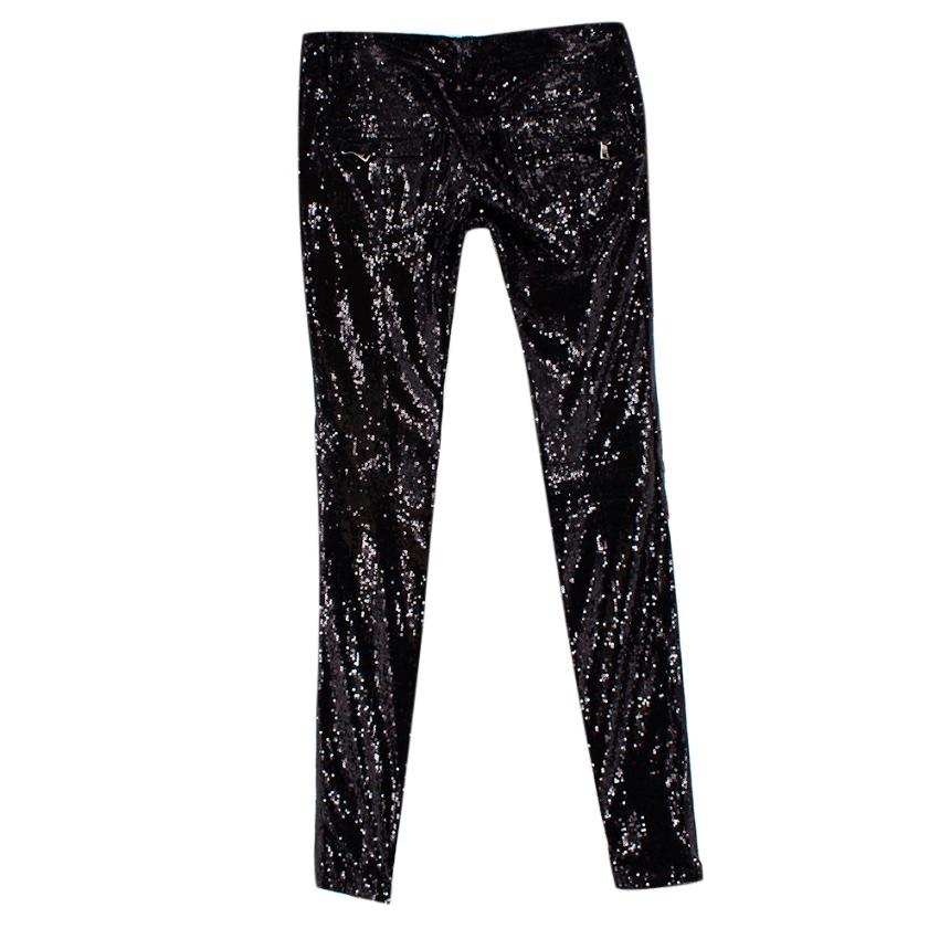Balmain Black Sequin Skinny Fit Zipped Trousers

-Gorgeous sequin texture 
-Zip details to the inside legs that allow for styling versatility 
-Cotton jersey fabric to the inside for comfort 
-4 pockets to the front, 2 to the back 
-Zip fastening to