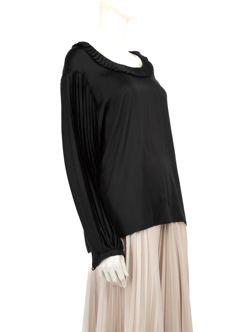 CONDITION is Very Good. Hardly any visible wear to top is evident on this used Balmain designer resale item.
 
 Details
 
 
 Black
 
 Silk
 
 Tip
 
 Long sleeves
 
 Pleated sleeve and neckline detail
 
 Button sleeve cuff detail
 
 
 
 
 
