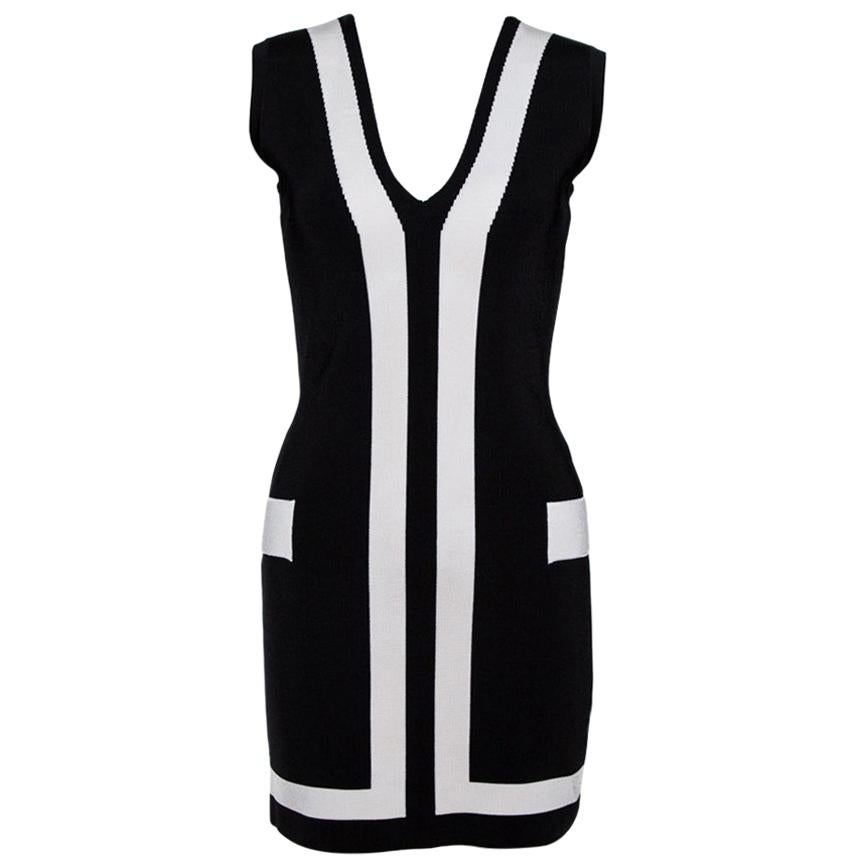 Balmain creations make a statement with their unique design aesthetic and chic silhouettes. This one here is no exception. Crafetd from stretch knit fabric, this bodycon dress comes in a classic shade of black. It has a sleeveless style, v-neckline,