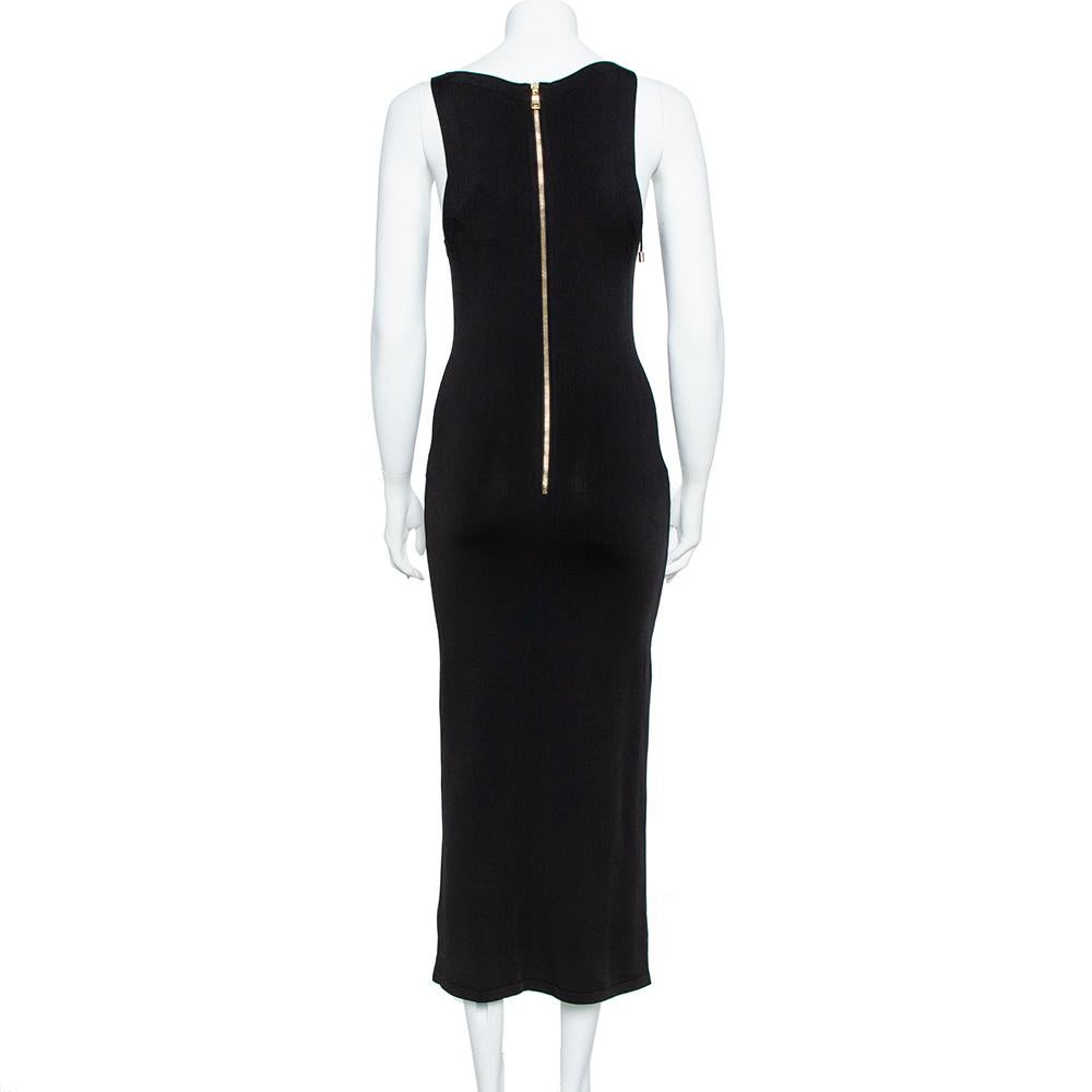 Elevate your style quotient with this fabulous midi dress from Balmain. The black creation is made of stretch knit fabric and features a flattering silhouette. It has been styled with a plunging V-neckline, front lace-up fastenings, and a zip