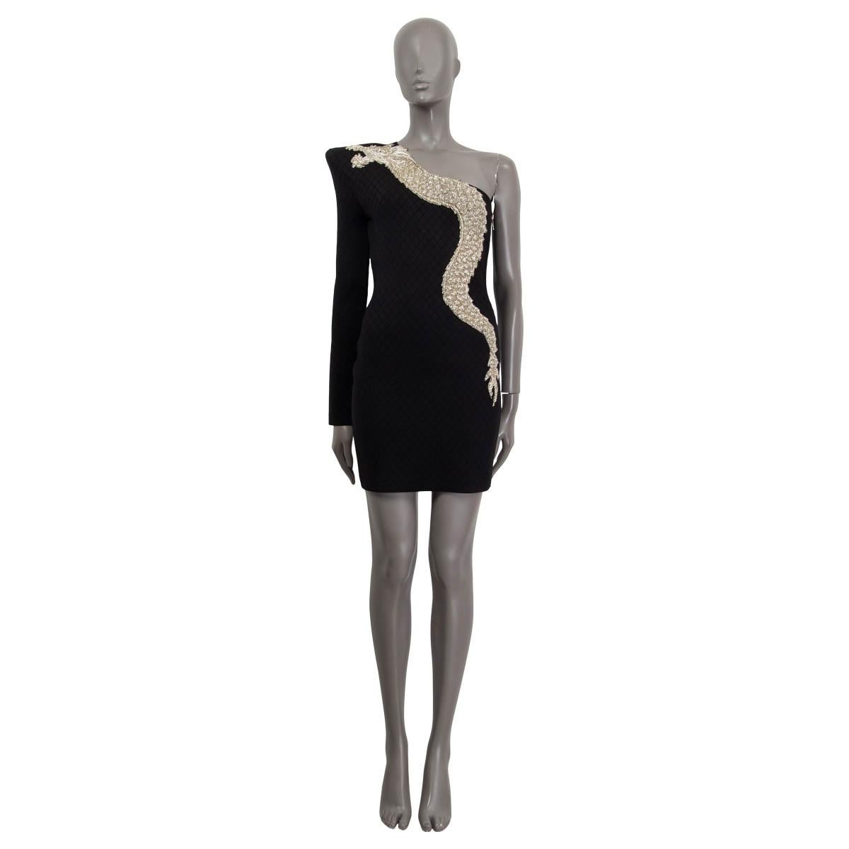 100% authentic Balmain Pre-Fall 2019 mini dress in black viscose (86%), polyamide (12%) and elastane (2%). Features one long sleeve, square textured knit and beaded dragon embroidery. Has one long sleeve with a shoulder pad. Opens with a silver