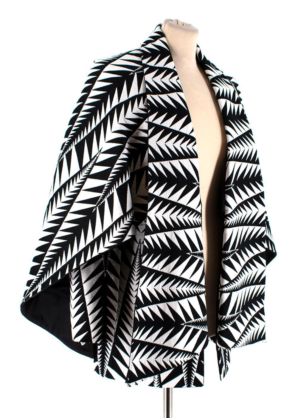Balmain Black & White Jacquard Cape Coat  

-Elegant hybrid style for a glamorous winter day
-Luxurious jacquard pattern
-Unexpected inverted oversize lapel 
-Cave over the sleeves 
-2 concealed pockets to the front under the lapel 
-Fully lined