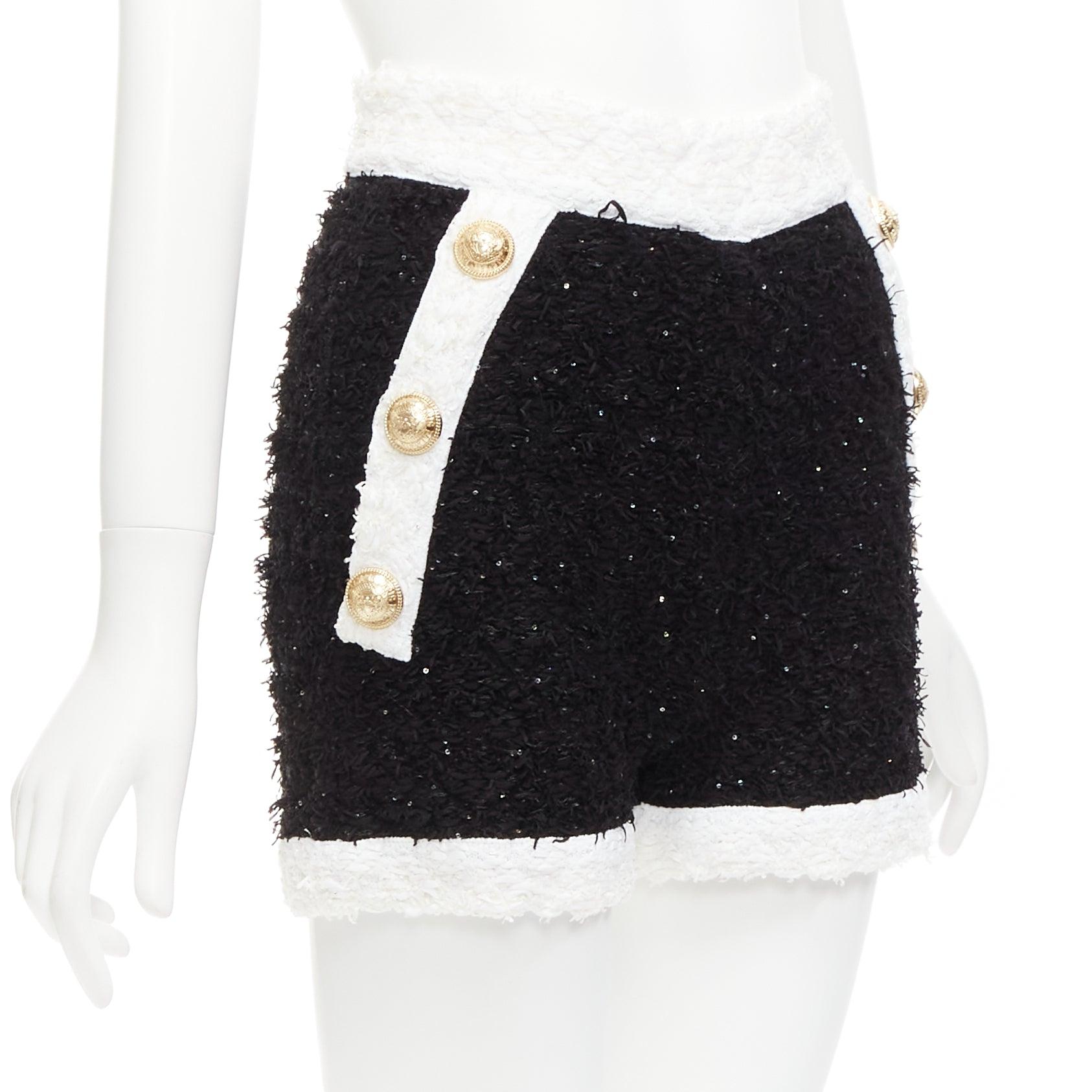 BALMAIN black white sequins tweed gold buttons zip high waisted shorts FR34 XS
Reference: AAWC/A00852
Brand: Balmain
Designer: Olivier Rousteing
Material: Viscose, Blend
Color: Black, White
Pattern: Solid
Closure: Zip
Extra Details: Gold exposed zip