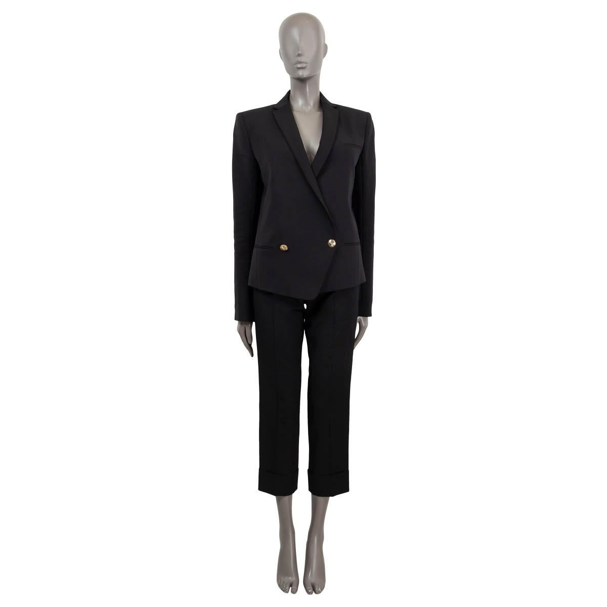 100% authentic Balmain two button blazer in black wool (95%) and elastane (5%). Features slip pocket on the chest, two slip pockets and buttoned cuffs. Closes with embossed logo gold-tone buttons an the front. Lined in black viscose (52%) and cupro