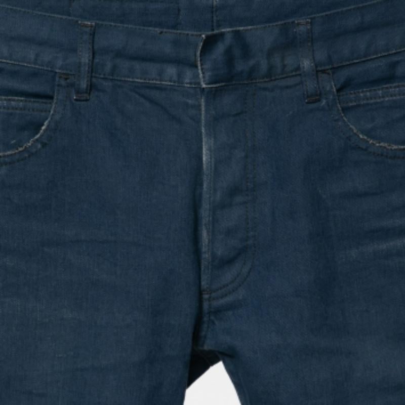 An edgy pair of shorts to add to your wardrobe is this blue one from Balmain. Made from comfortable cotton, these shorts feature a distressed design, frayed edges on the hems, a buttoned closure, and external pockets.