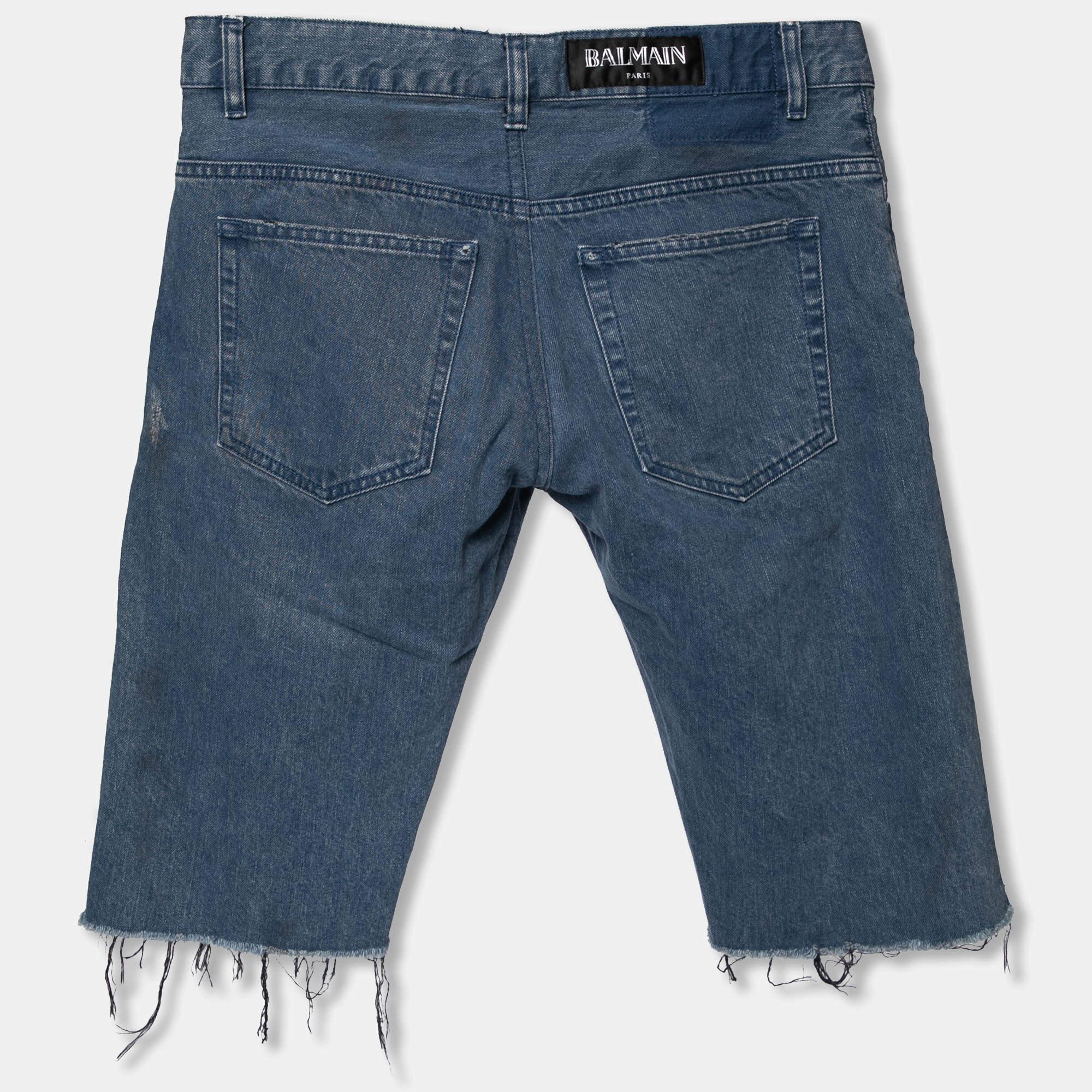 An edgy pair of shorts to add to your wardrobe is this blue one from Balmain. Made from comfortable cotton, these shorts feature a distressed design, frayed edges on the hems, a buttoned closure, and external pockets.

