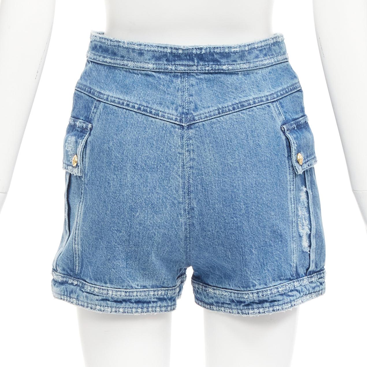 BALMAIN blue distressed denim gold buttons high waisted cargo shorts FR34 XS
Reference: AAWC/A00860
Brand: Balmain
Designer: Olivier Rousteing
Material: Denim
Color: Blue, Gold
Pattern: Solid
Closure: Snap Buttons
Extra Details: Snap button nautical