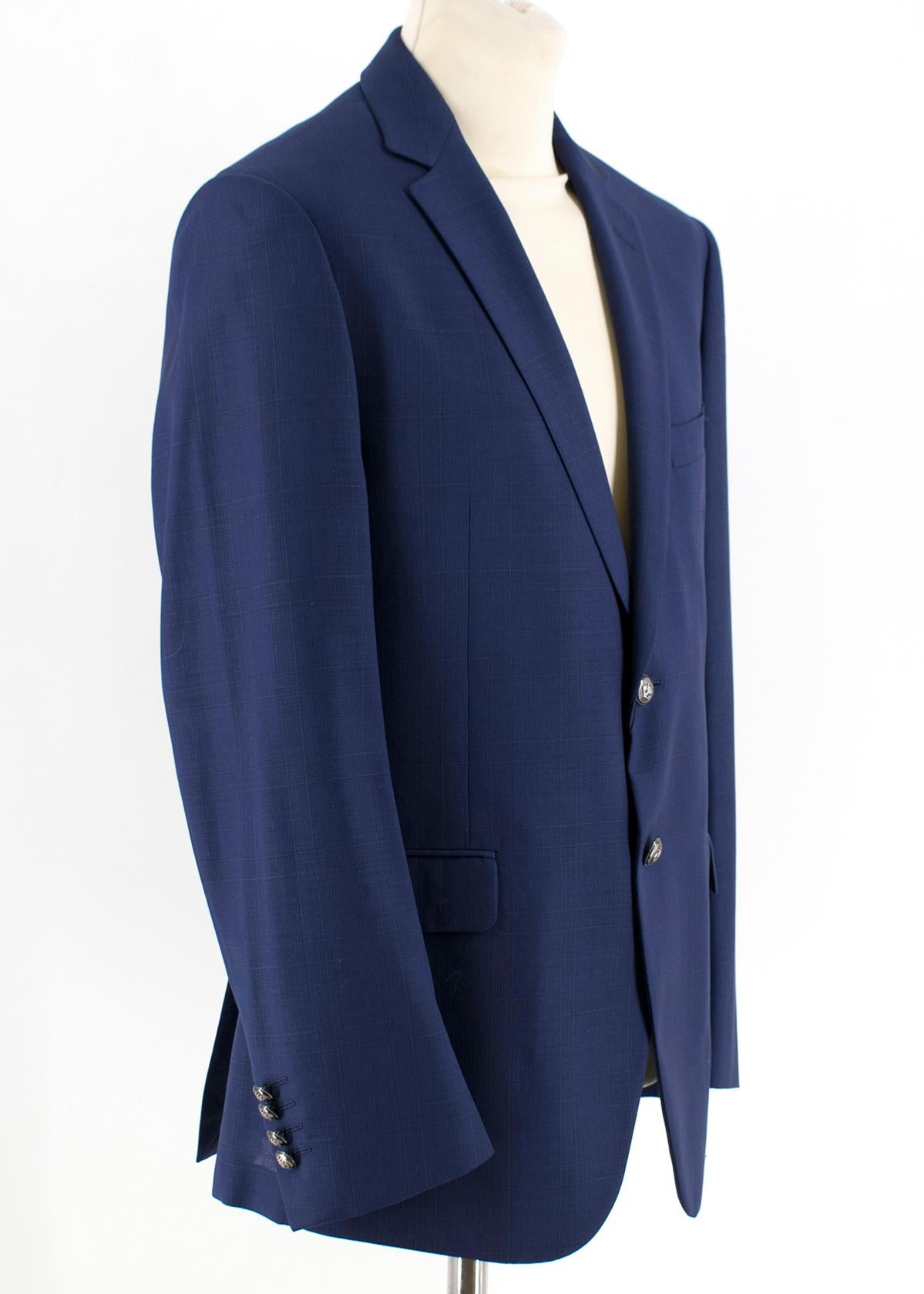 Balmain Blue Single Breasted Slim Fit Wool Blazer

Blue single breasted jacket, 
Two front flap pockets, 
Left chest pocket,
Silver-grey tone buttons in front with crown detailing,
Standard notch lapel collar, 
Buttons along cuffs, 
Two interior