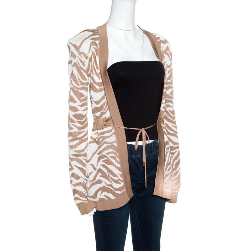 If stylish is what defines you, then this jacket from Balmain is just perfect. The piece has been made from the finest fabrics, and it features zebra patterns in brown and white, long sleeves and a drawstring detail. Pair this jacket over your slim