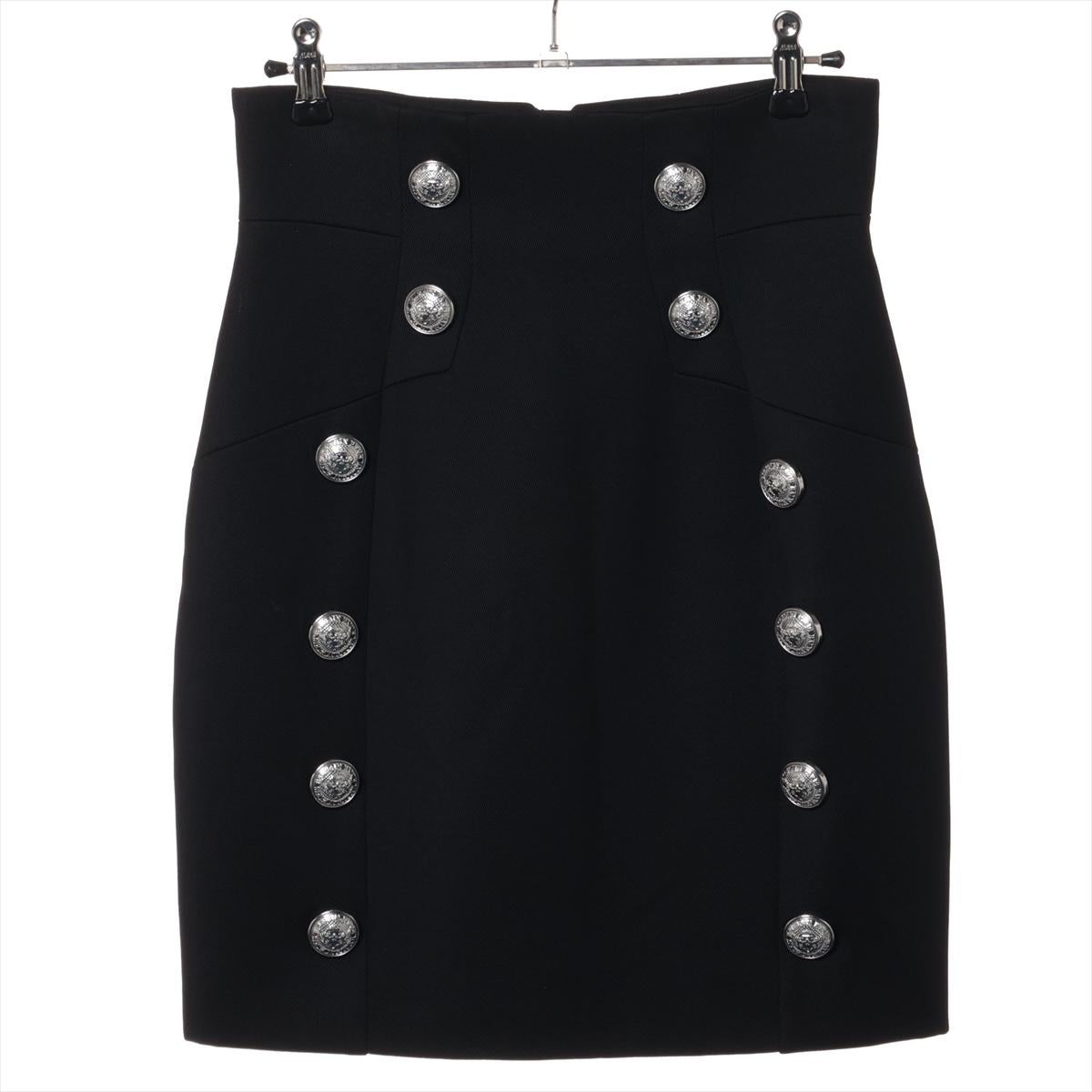 *ships about 12/11

The Balmain Button Wool Rayon Mini Skirt in Black is a sleek and sophisticated piece that embodies the brand's signature elegance. Crafted from a luxurious blend of wool and rayon, the mini skirt offers a flattering fit with a