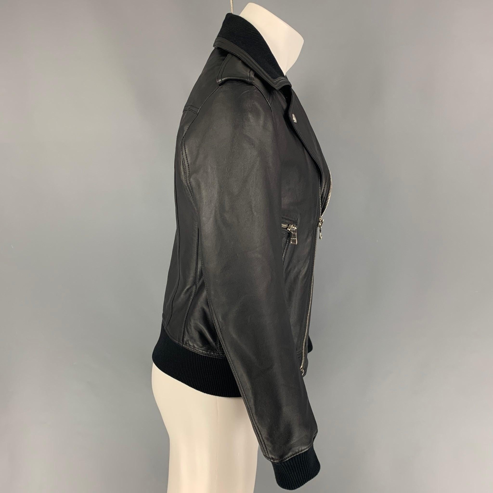 BALMAIN by Olivier Rousteing jacket comes in a black leather featuring a motorcycle style, ribbed hem, silver tone hardware, front pockets, epaulettes, and a full zip up closure.
Very Good
Pre-Owned Condition. 

Marked:   48 

Measurements: 
