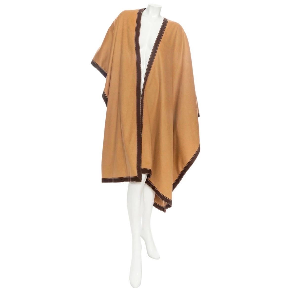Balmain Camel Wool-Blend Contrast-Trim Draped Poncho

Fall 2020 Collection by Olivier Rousteing
Camel/Brown
Reversible
Open sides
Asymmetrical
Made in Bulgaria
97% wool, 3% cashmere
New with tags; excellent condition
Size & Measurements
Approximate,